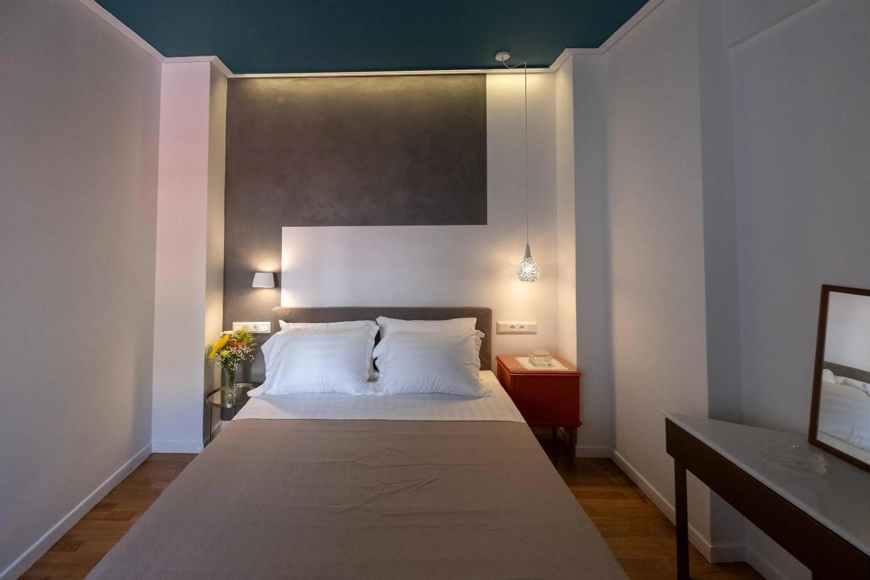 Bed in ATHENIAN YARD SUITES