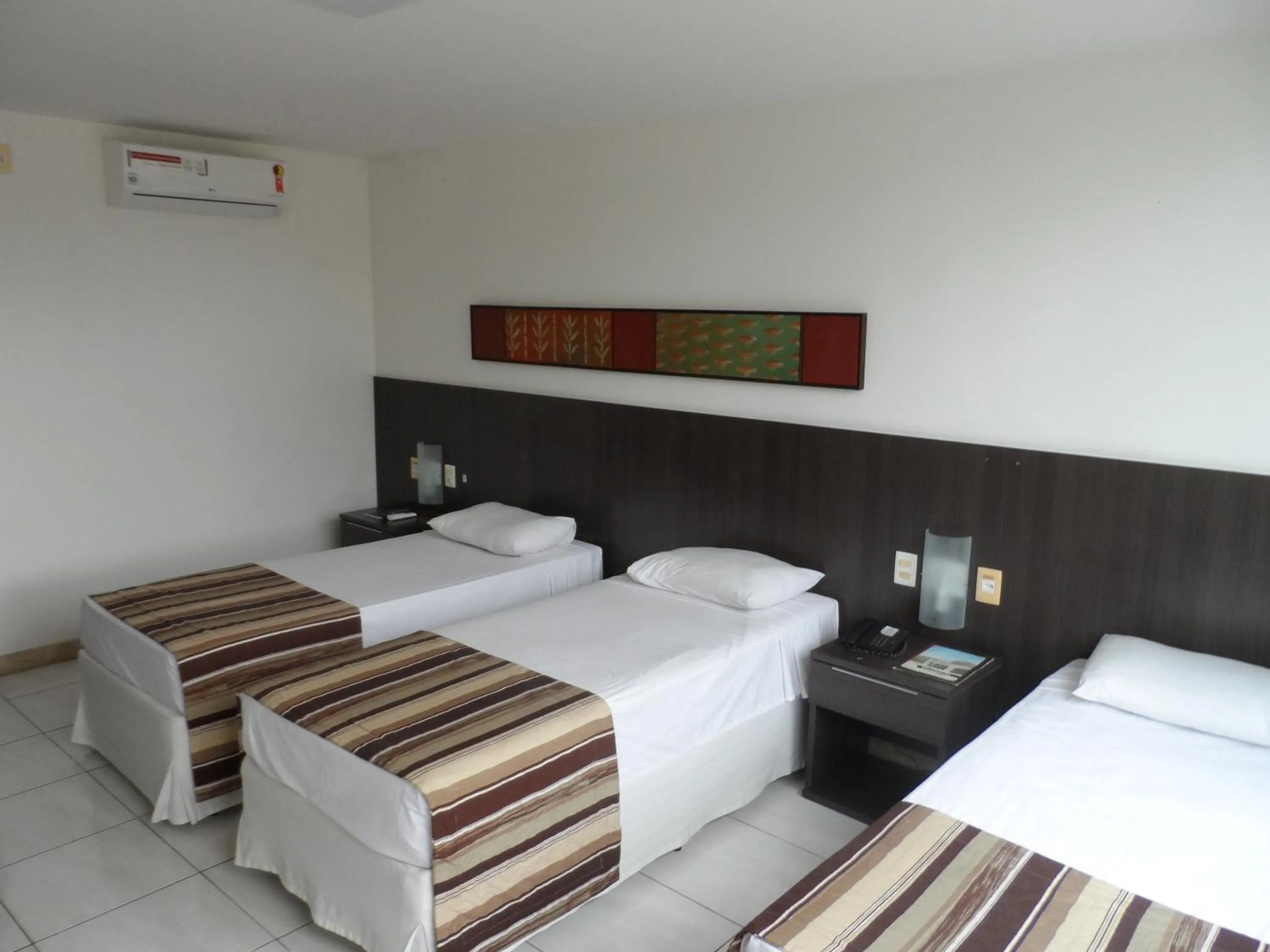 Bed in Cambuci Hotel