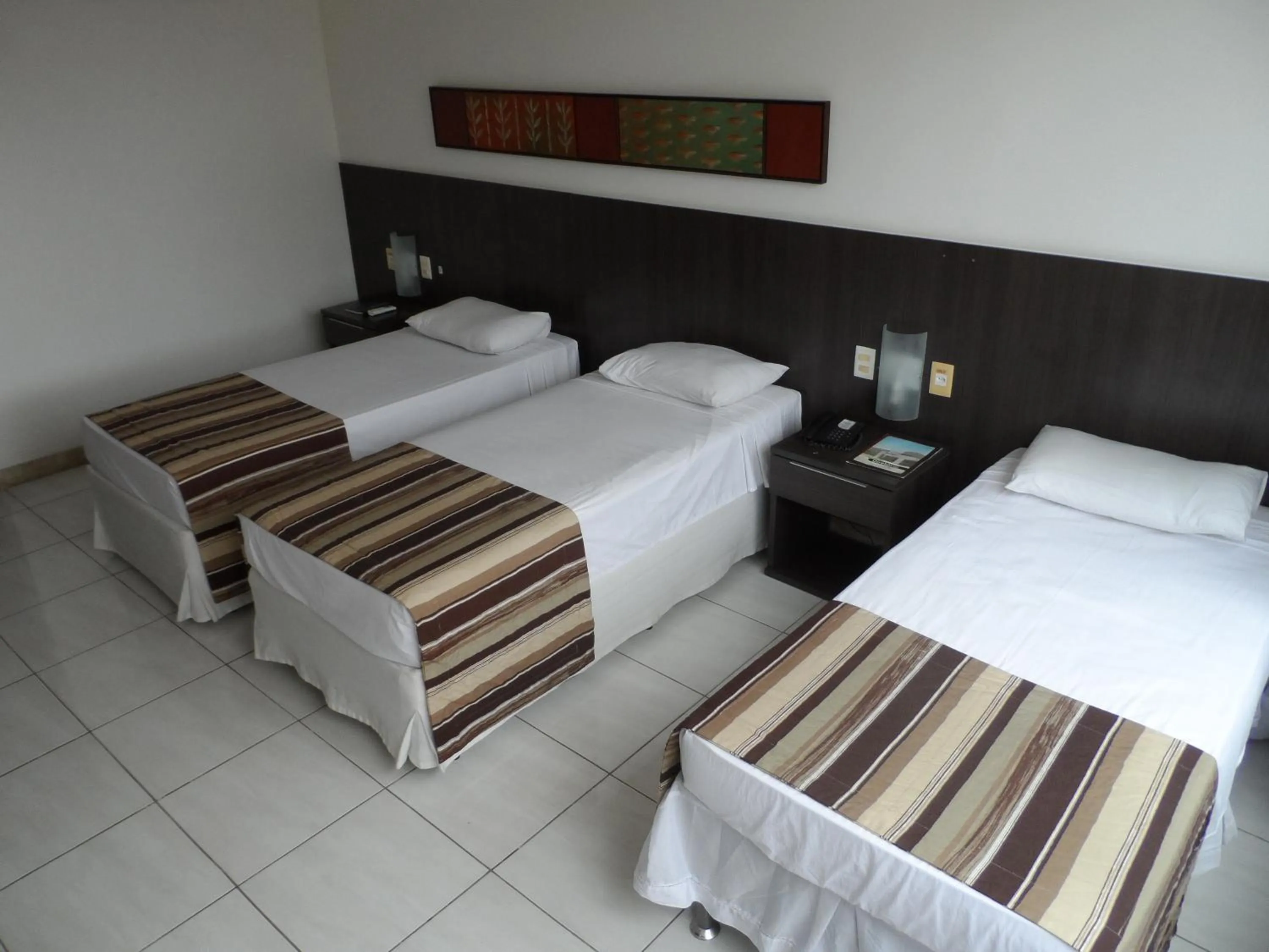 Bed in Cambuci Hotel