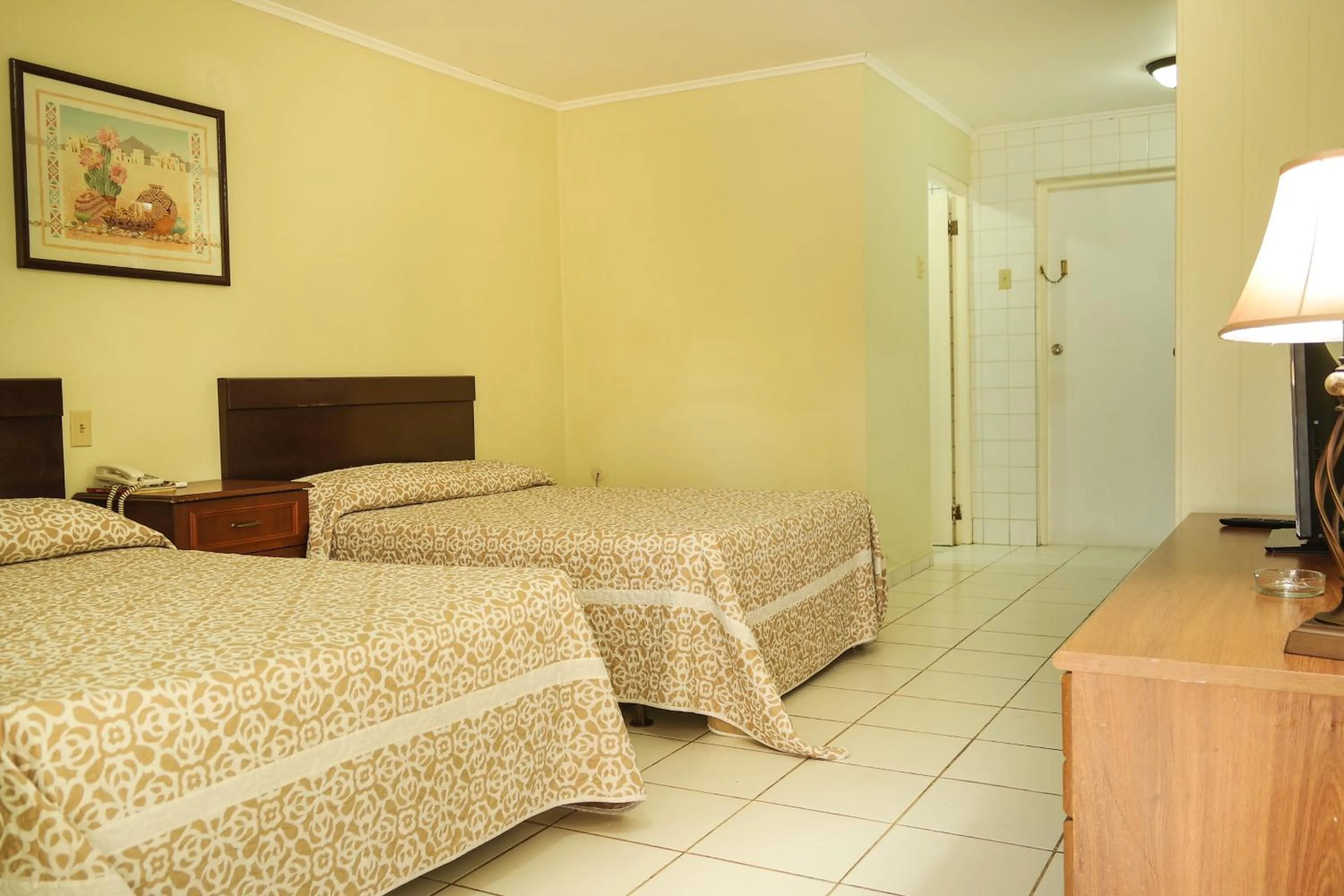 Photo of the whole room, Bed in Coconut Inn