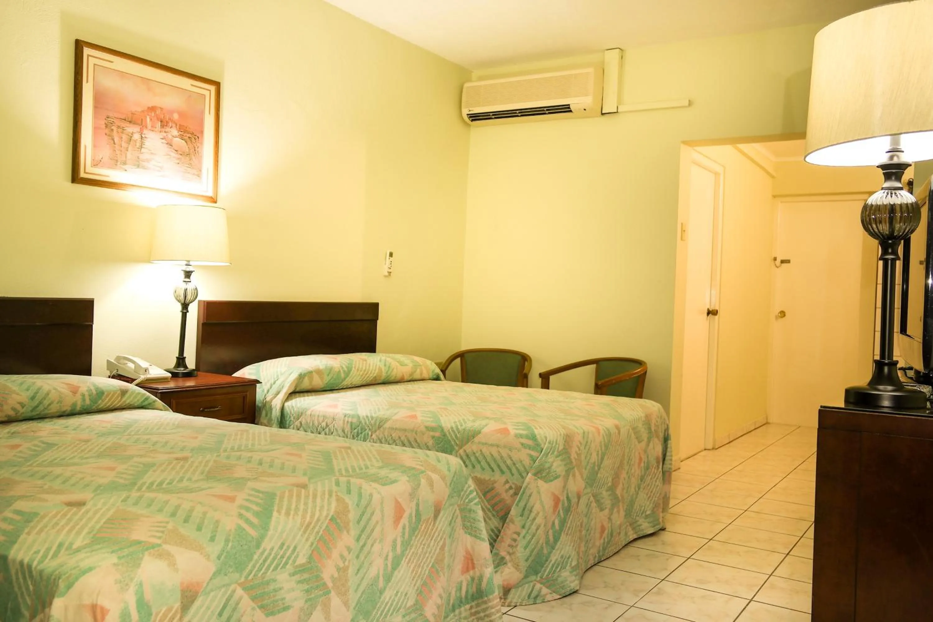 Photo of the whole room, Bed in Coconut Inn