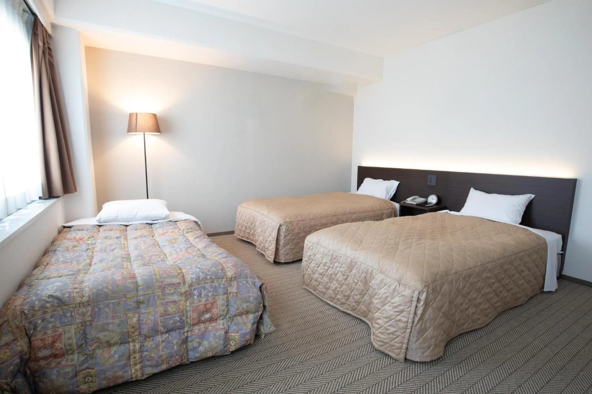 Bed in Hotel Sunroute Matsuyama