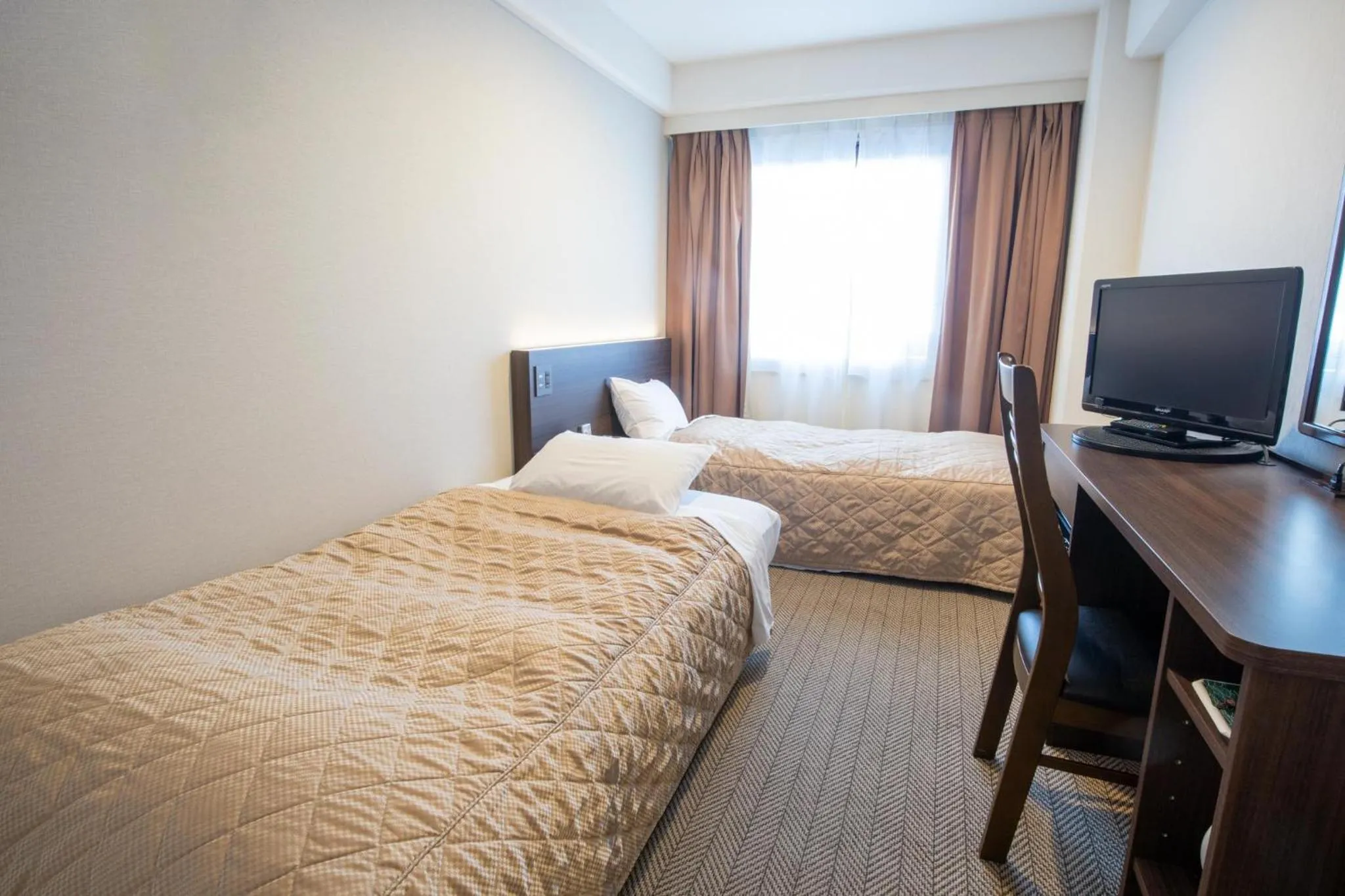 Bed in Hotel Sunroute Matsuyama