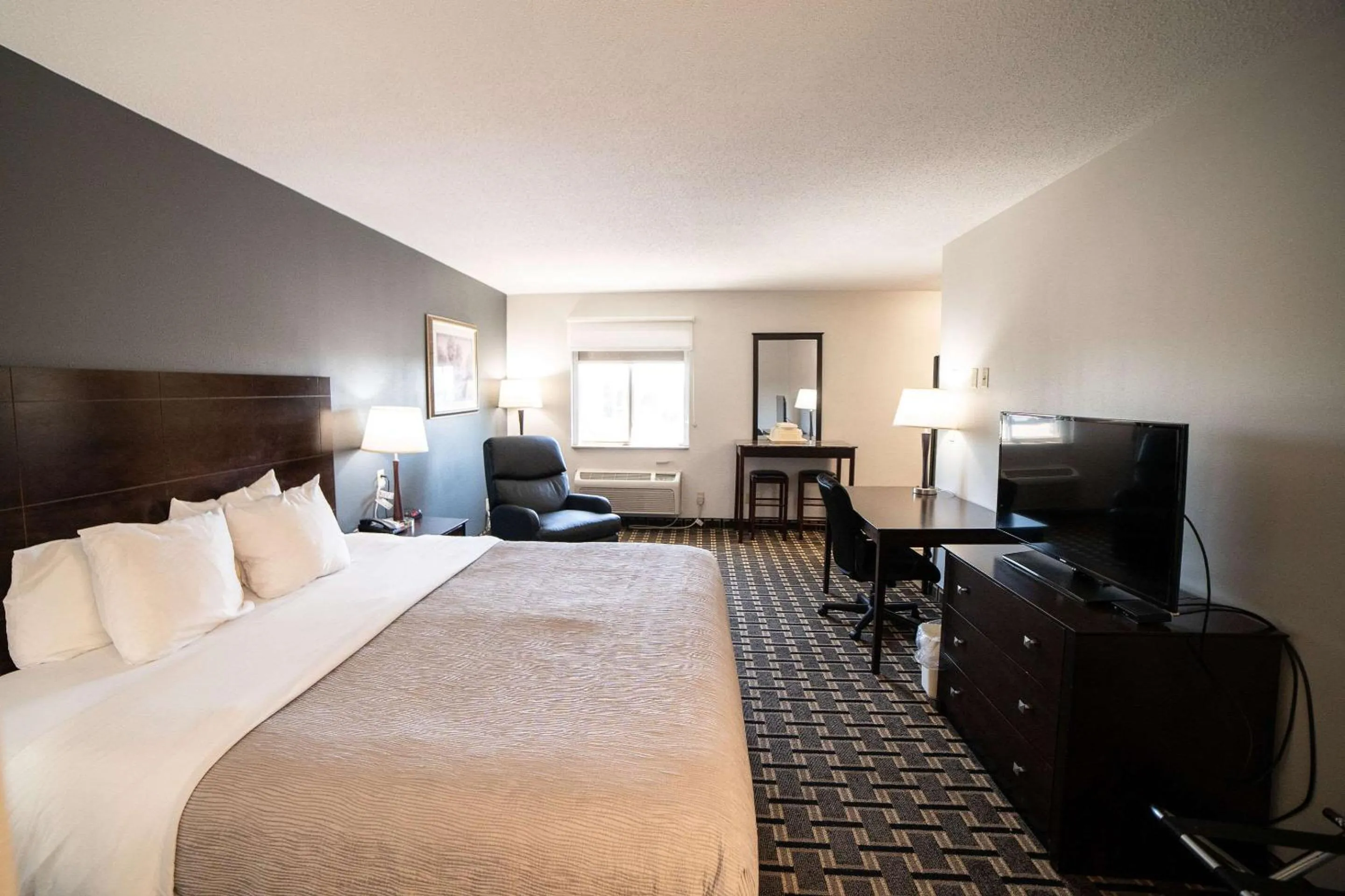 Bedroom, Bed in Quality Inn & Suites Watertown near Prairie Lakes Ice Arena