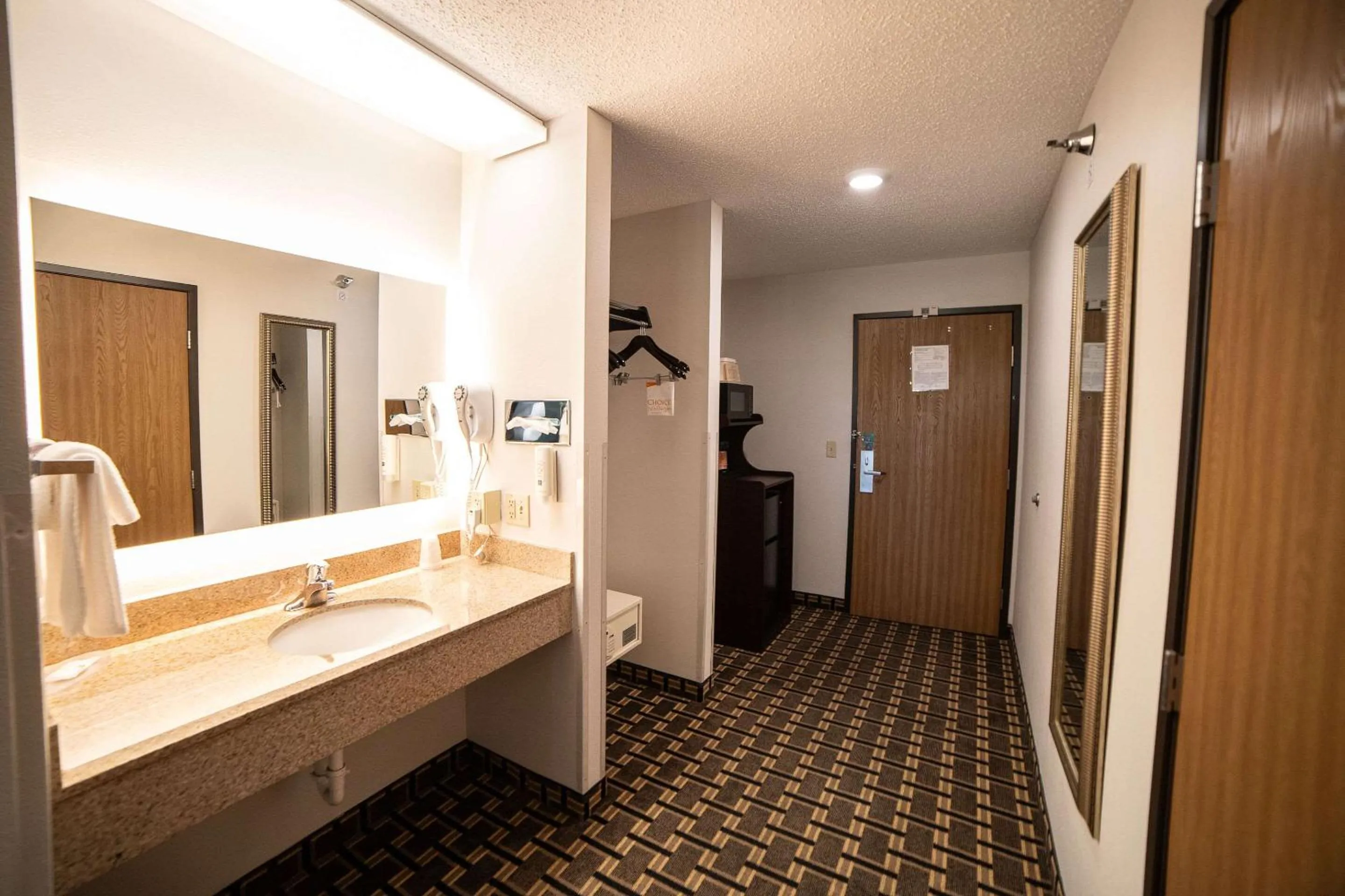 Bedroom in Quality Inn & Suites Watertown near Prairie Lakes Ice Arena