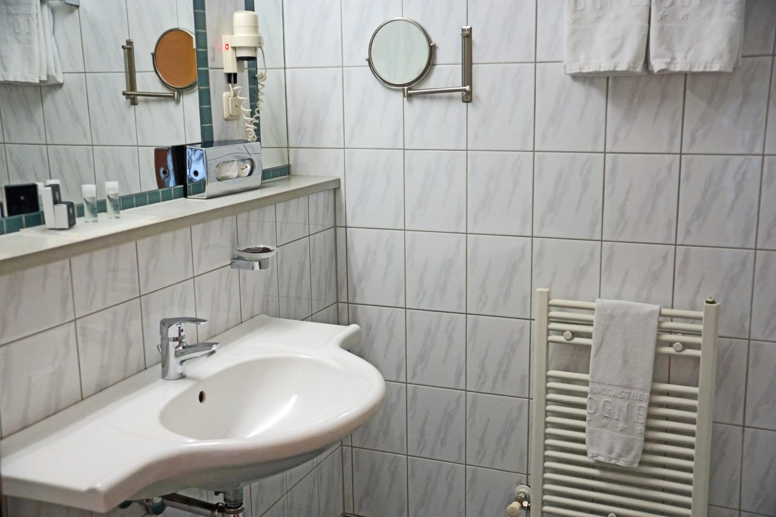 Bathroom in Landgasthof Bogner by SMK Event und Gastro