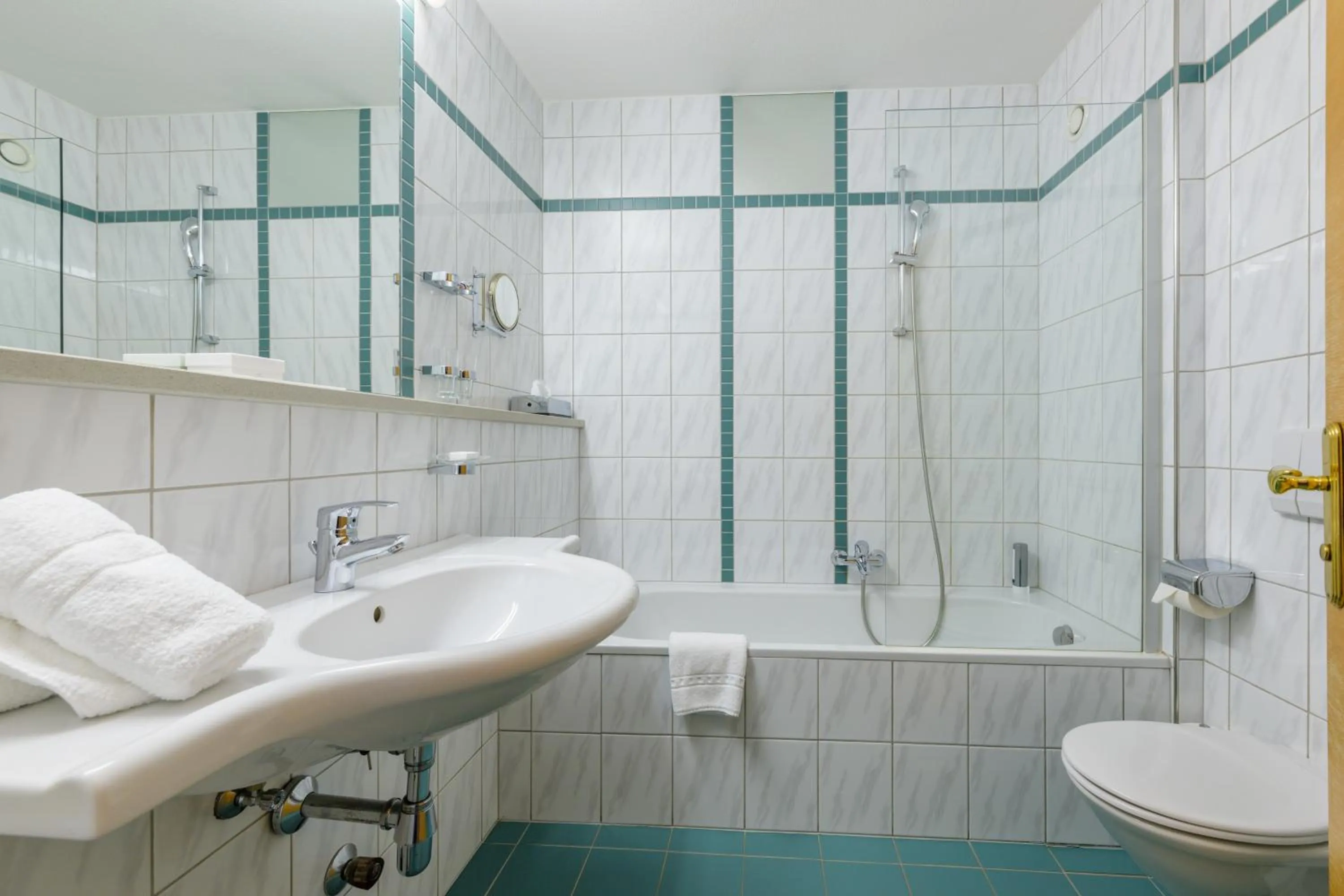 Bathroom in Landgasthof Bogner by SMK Event und Gastro