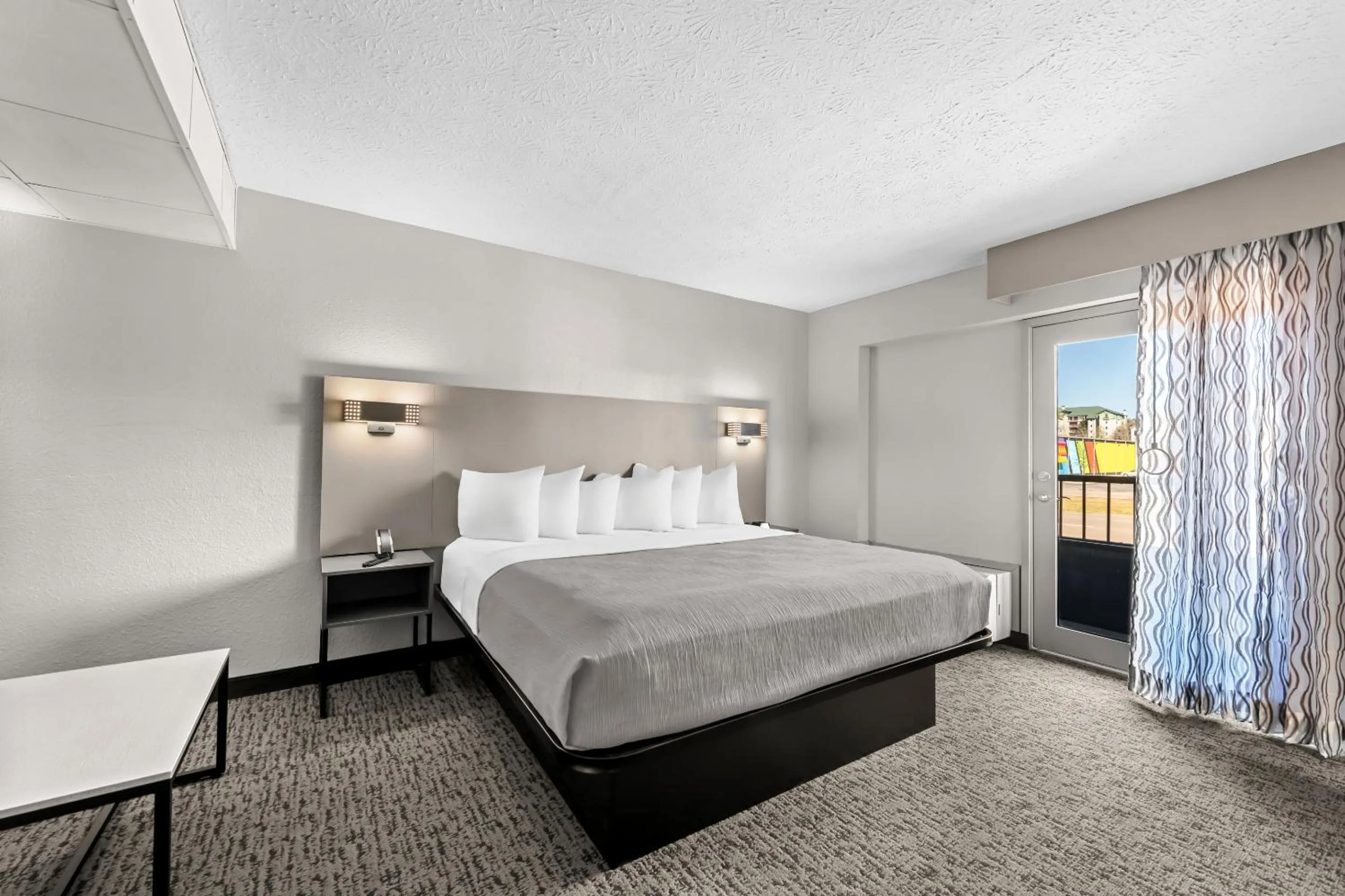 Bed in Quality Inn & Suites at Dollywood Lane