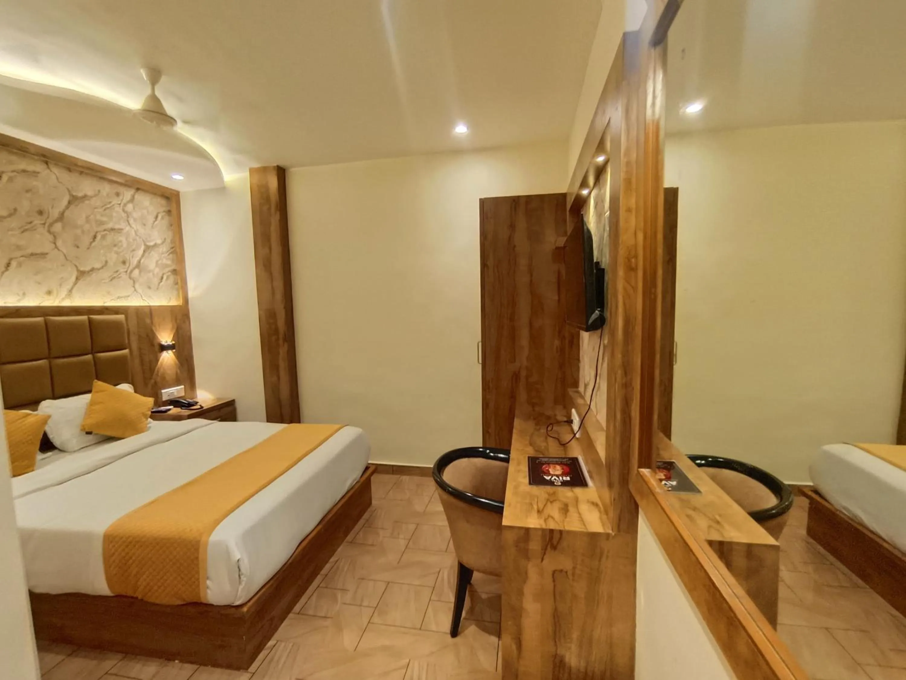 Bed in Hotel Riva International Goregaon- Near NESCO