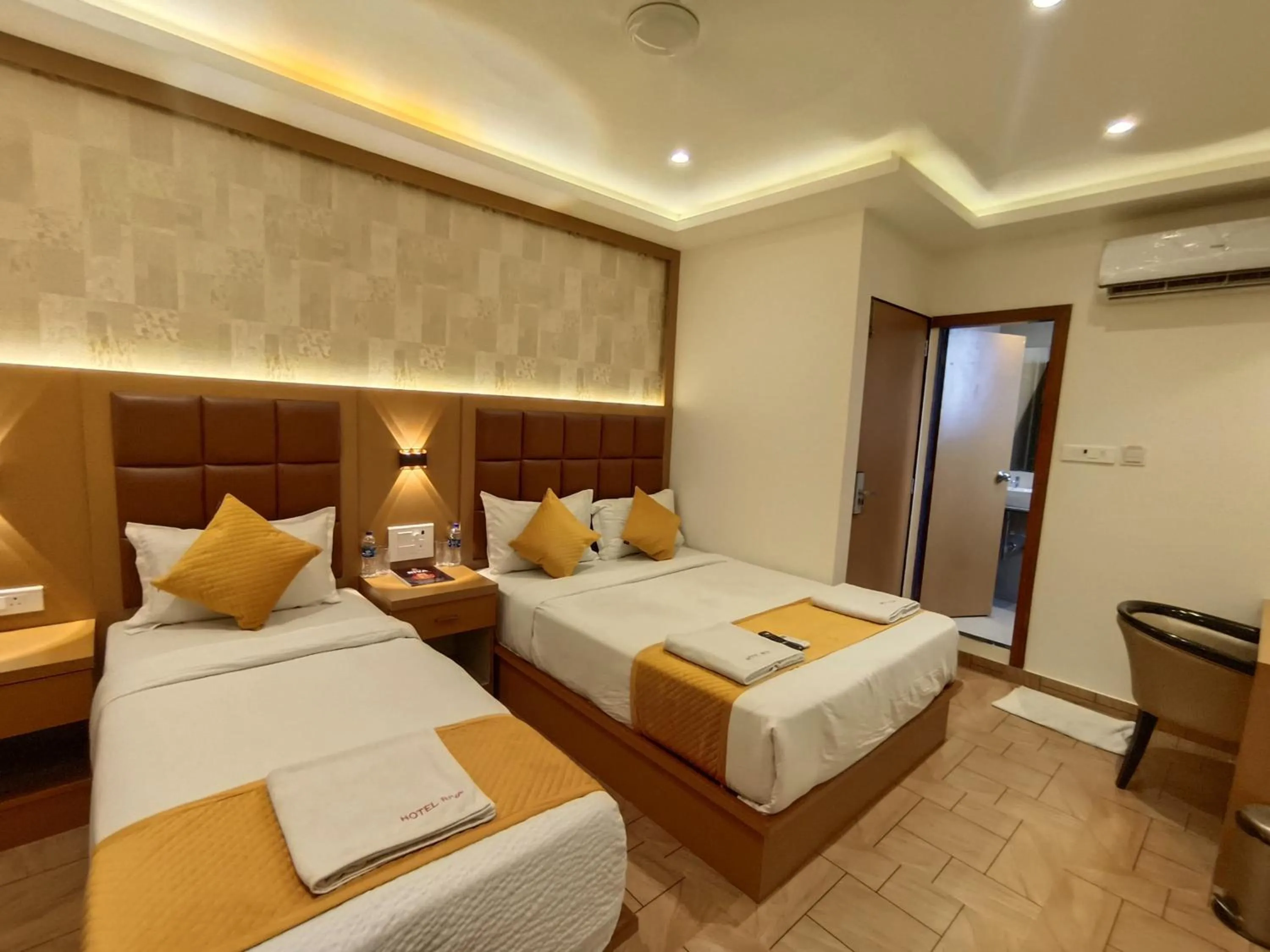 Bed in Hotel Riva International Goregaon- Near NESCO