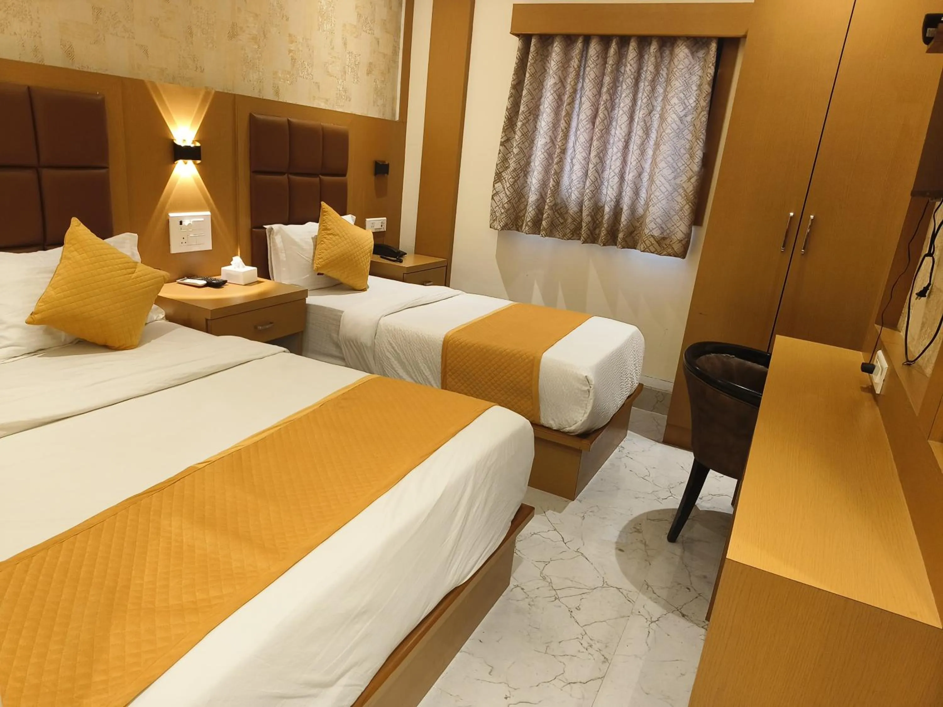 Bed in Hotel Riva International Goregaon- Near NESCO