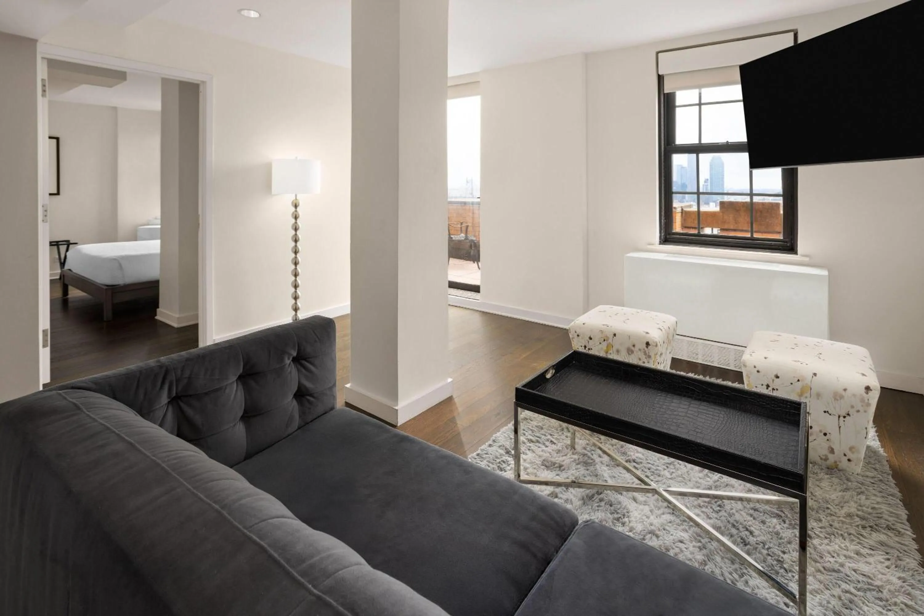 Living room, Bed in The Beekman Tower, Trademark Collection by Wyndham