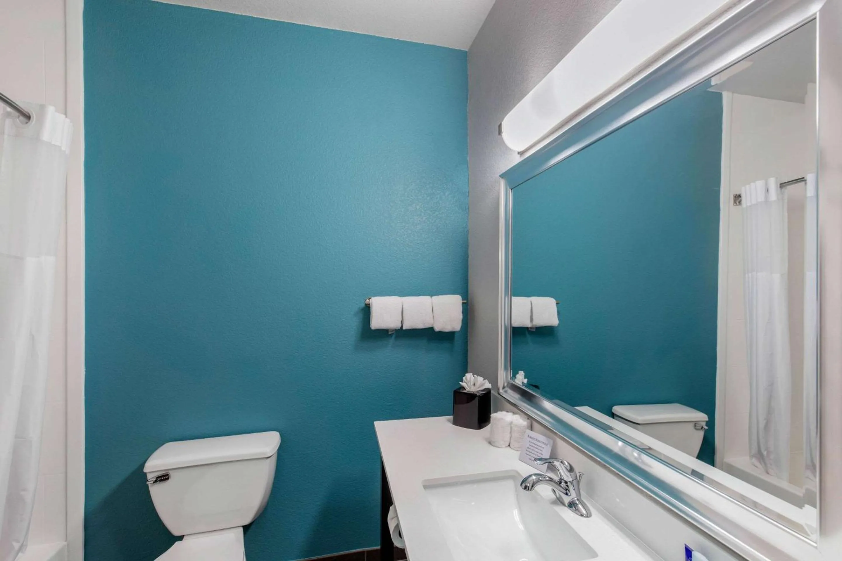 Bedroom in Clarion Inn & Suites DFW North