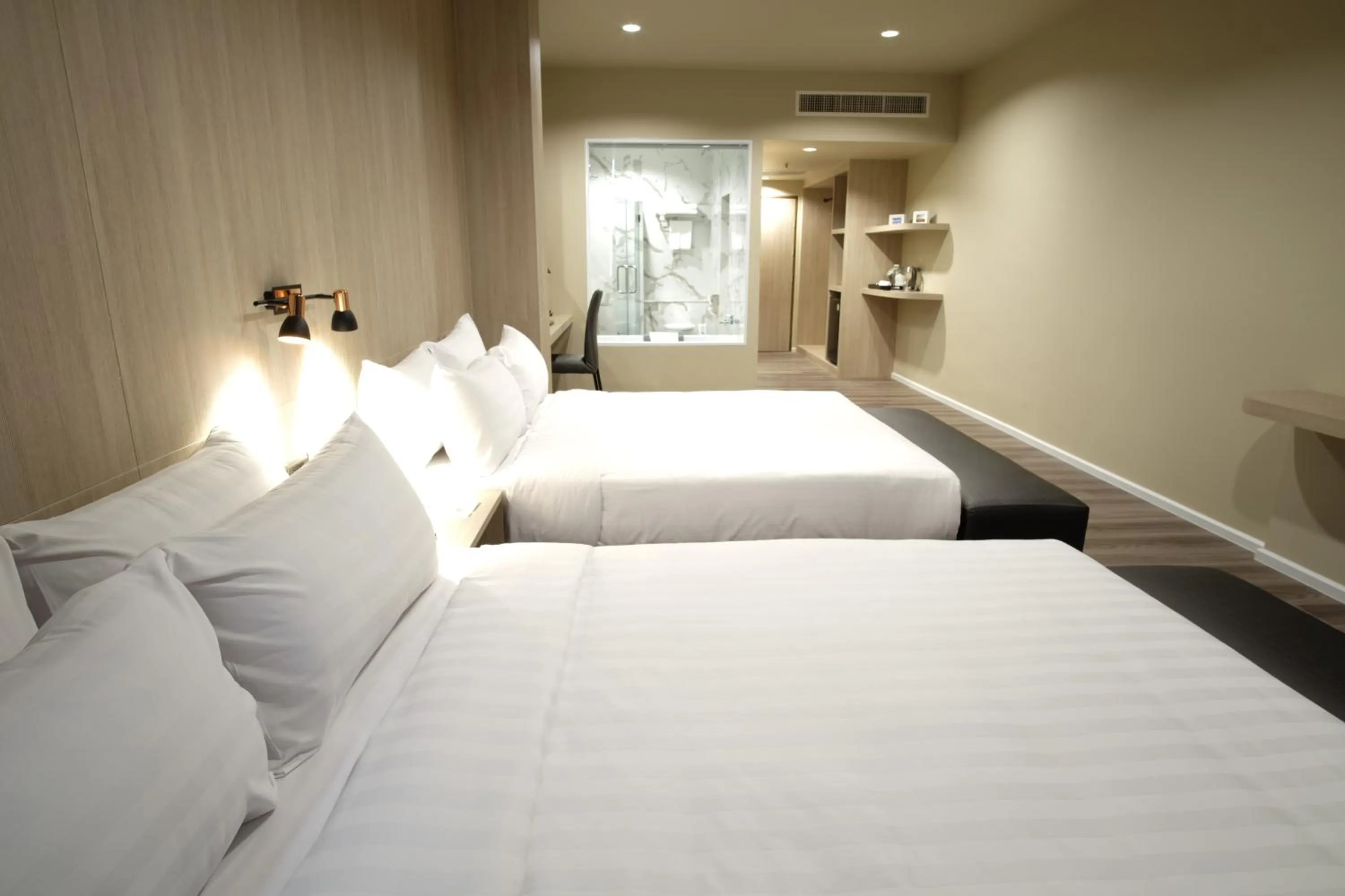 Bed in Gold Orchid Bangkok Hotel