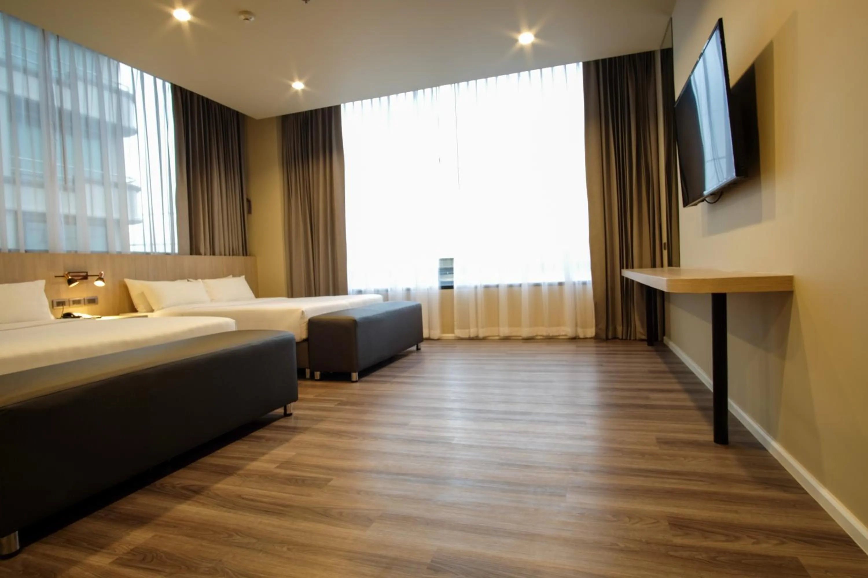 Bed in Gold Orchid Bangkok Hotel