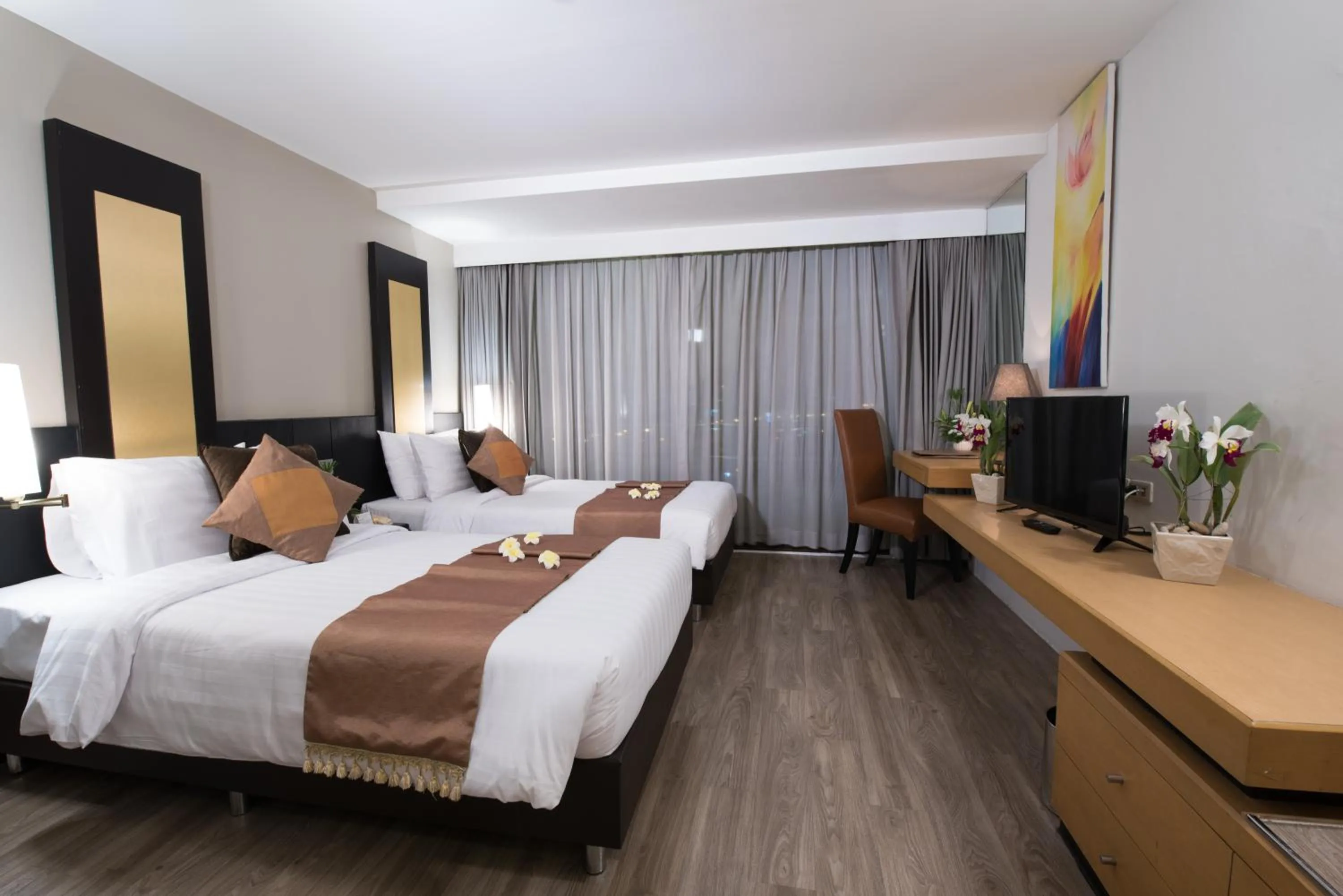 Bed in Gold Orchid Bangkok Hotel