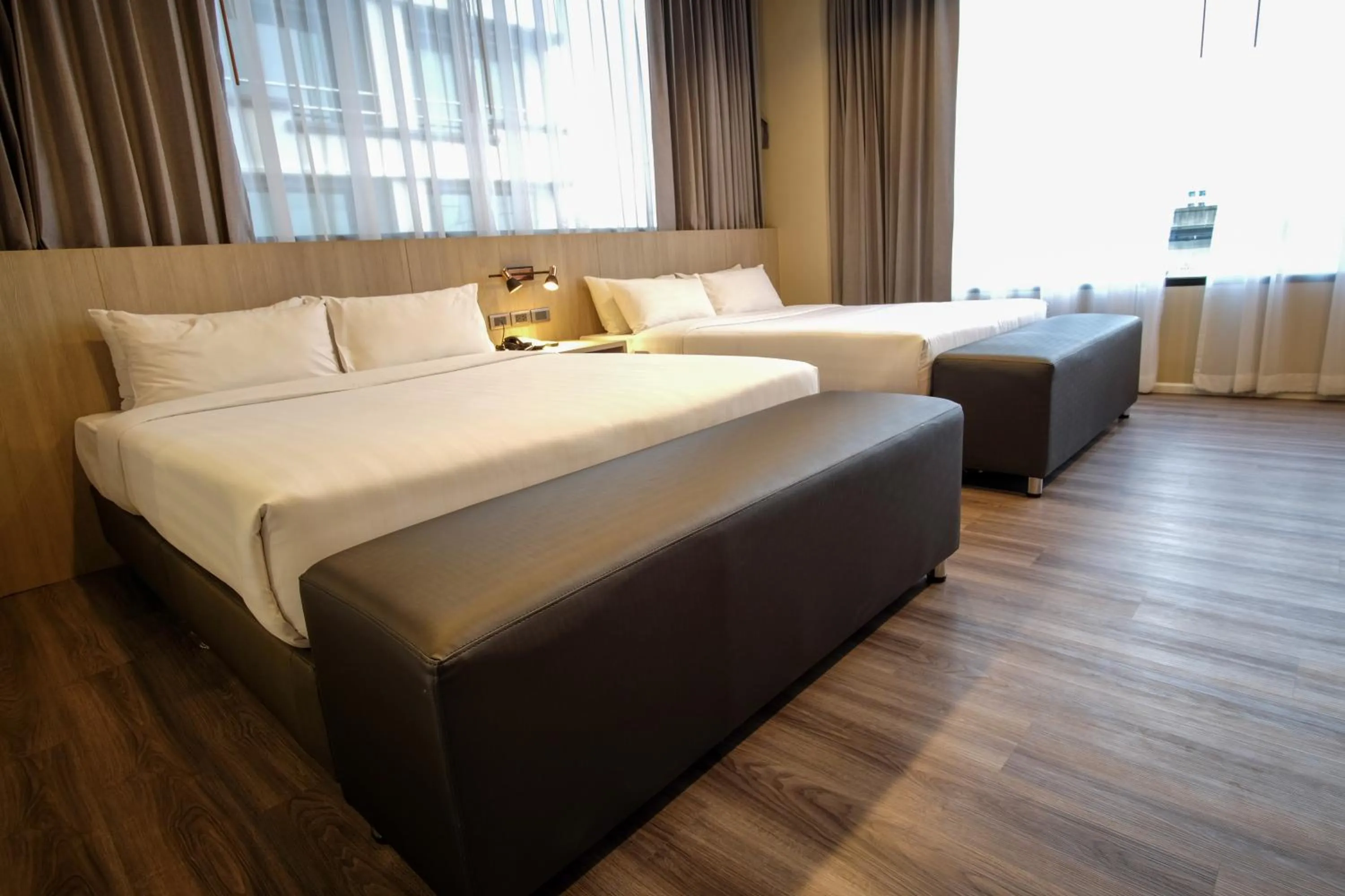 Bed in Gold Orchid Bangkok Hotel