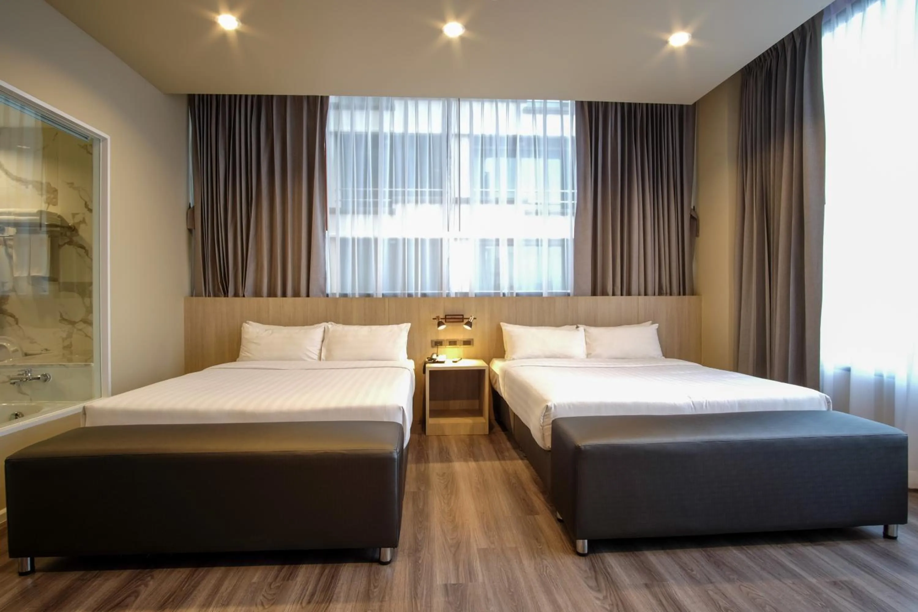 Bed in Gold Orchid Bangkok Hotel