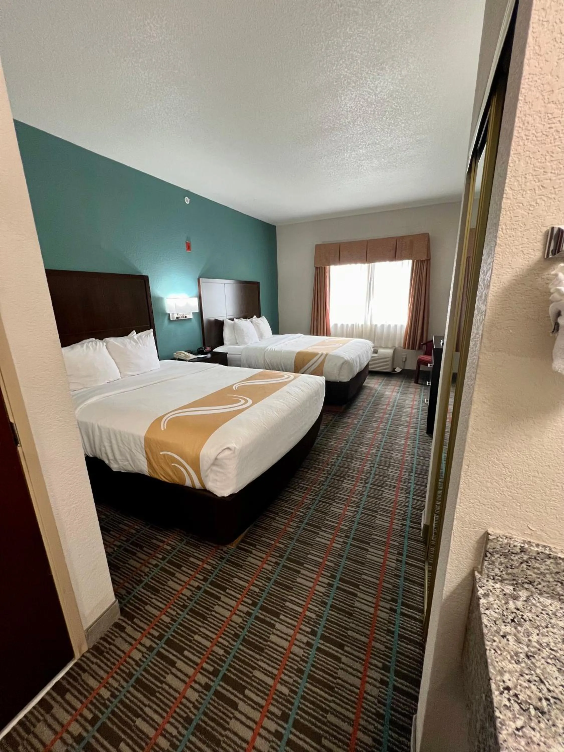 Bed in Quality Inn & Suites Near University
