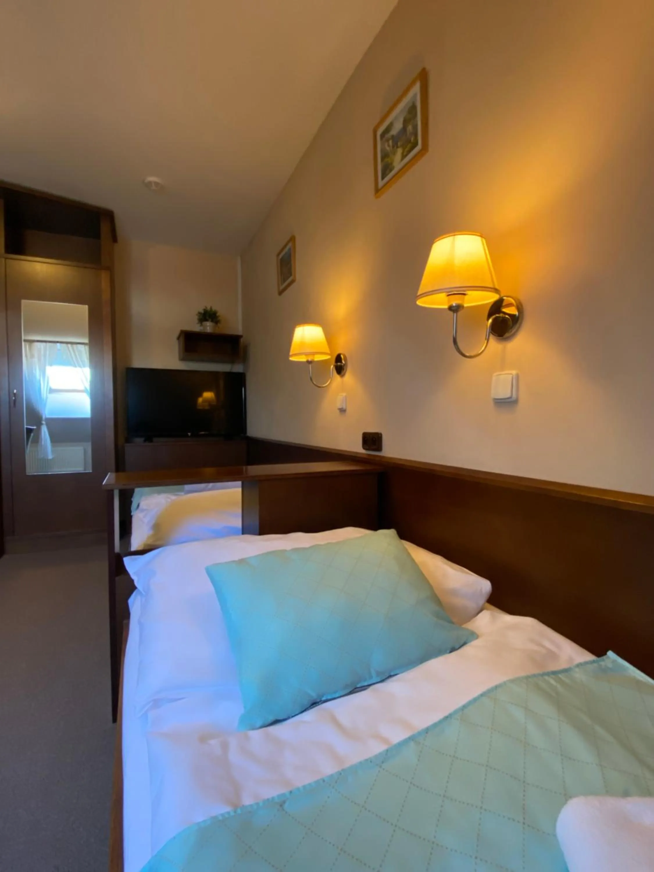 Bed in Zámecký Hotel Zlatý Orel