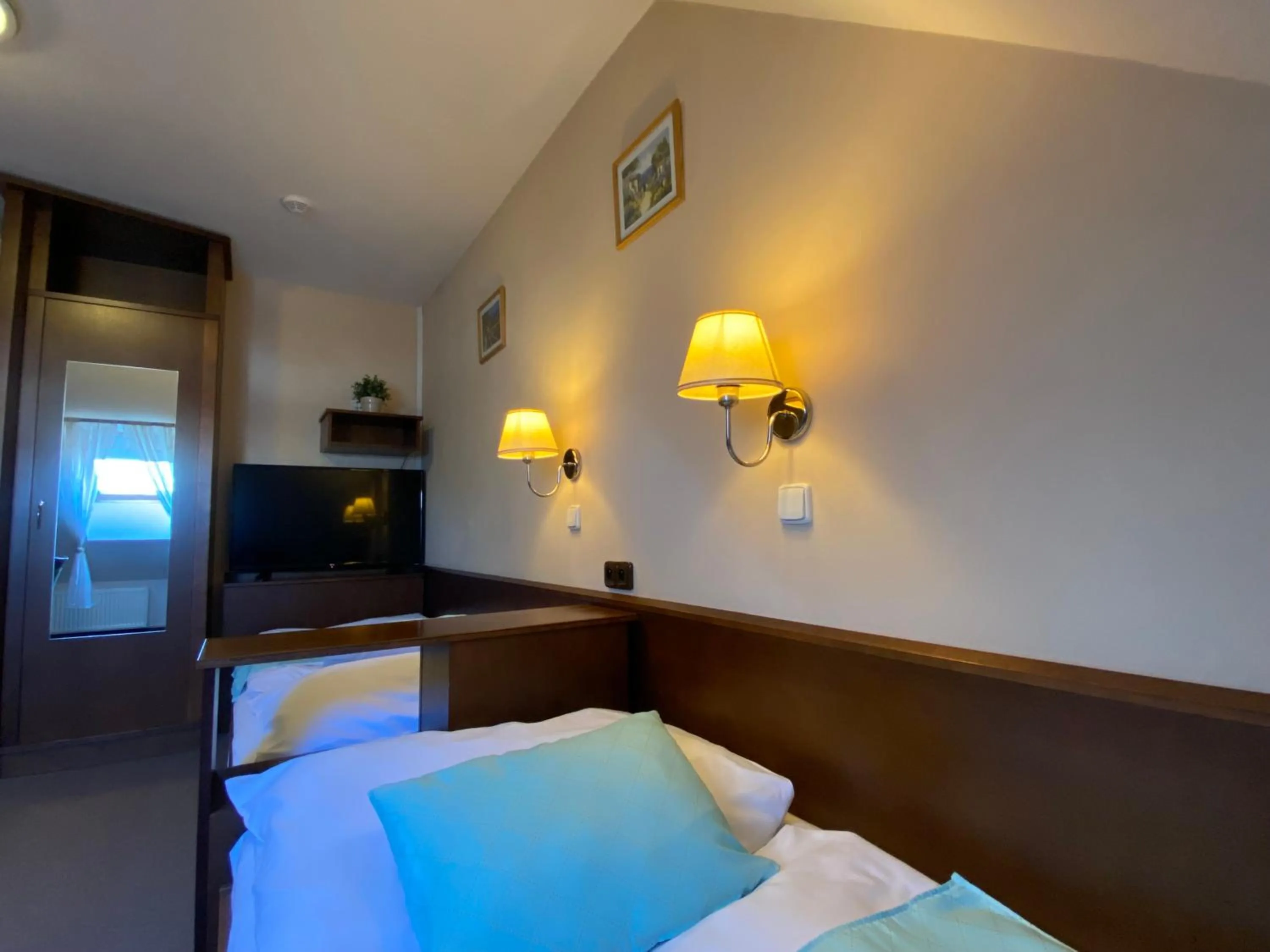 Bed in Zámecký Hotel Zlatý Orel