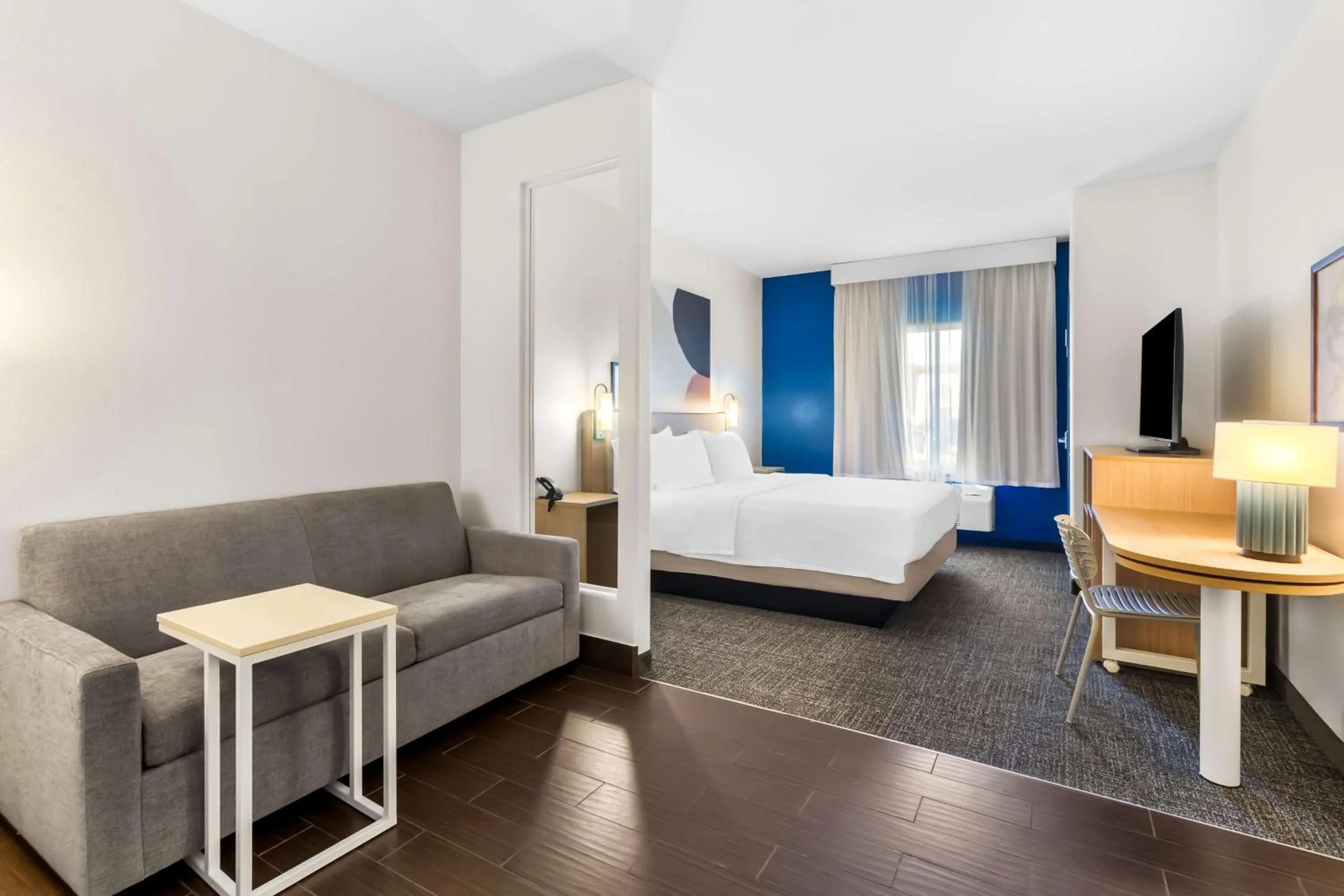 Living room, Bed in Spark by Hilton Pearland