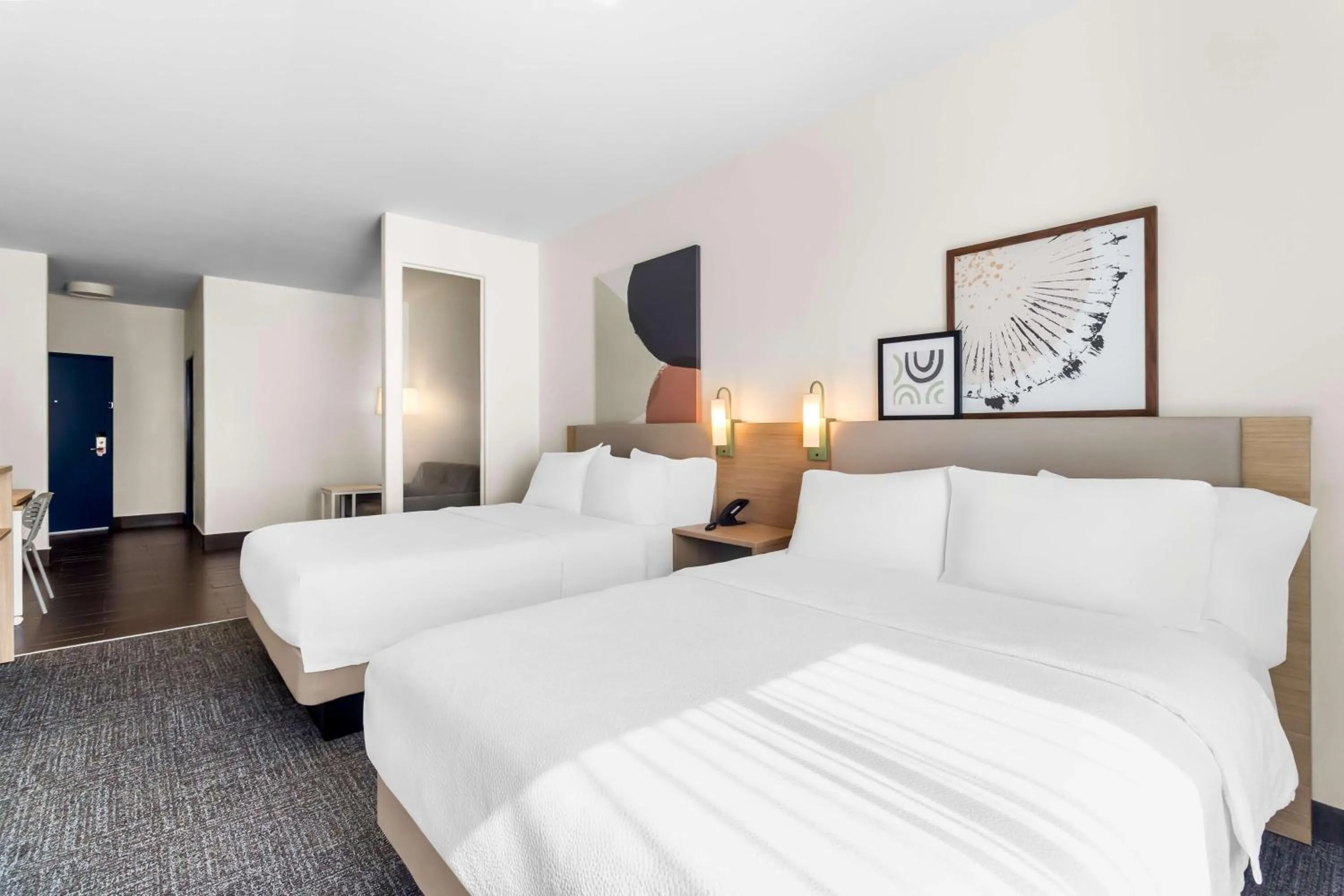 Living room, Bed in Spark by Hilton Pearland