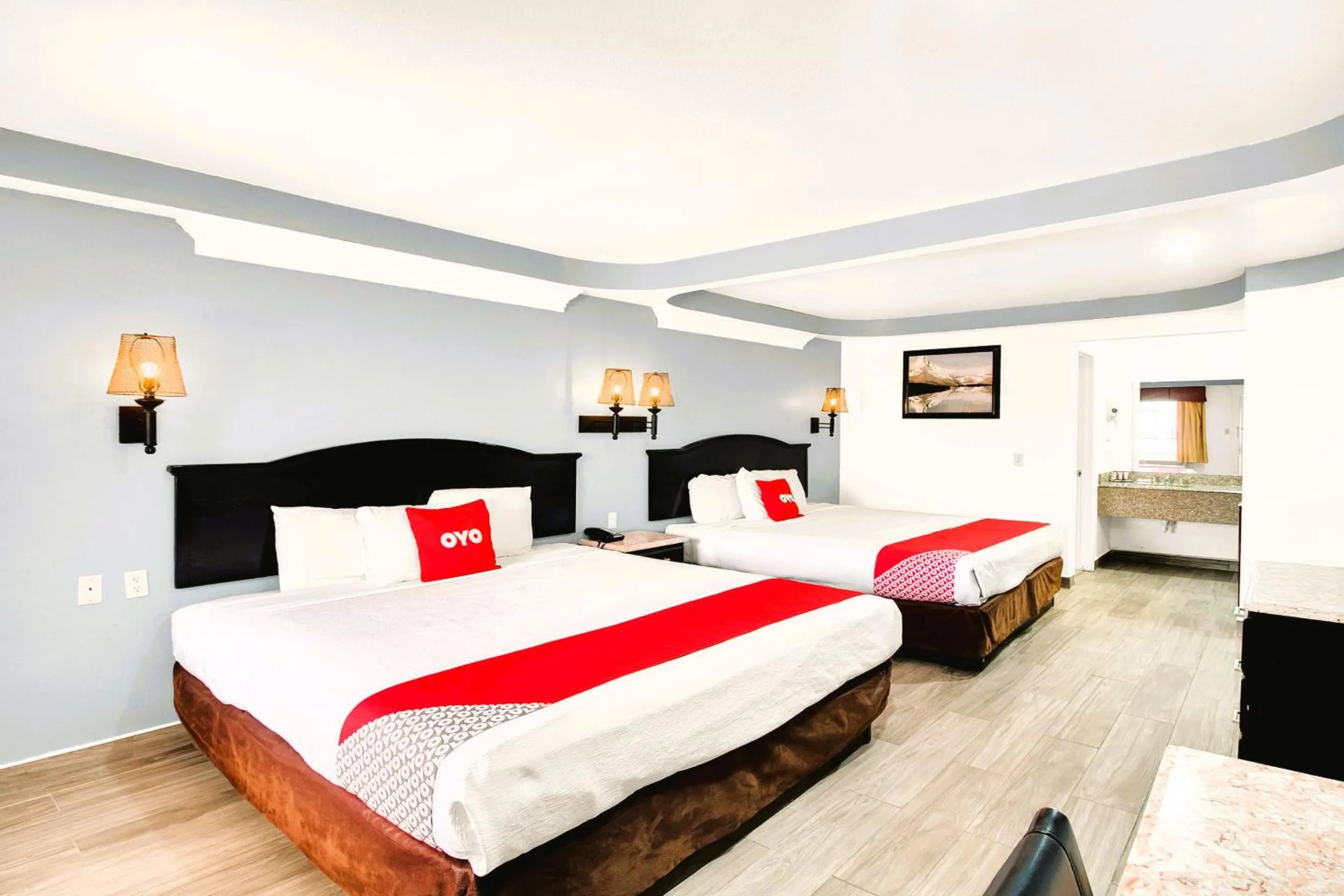 Bedroom, Bed in Three Rivers Executive Inn & Suites By OYO