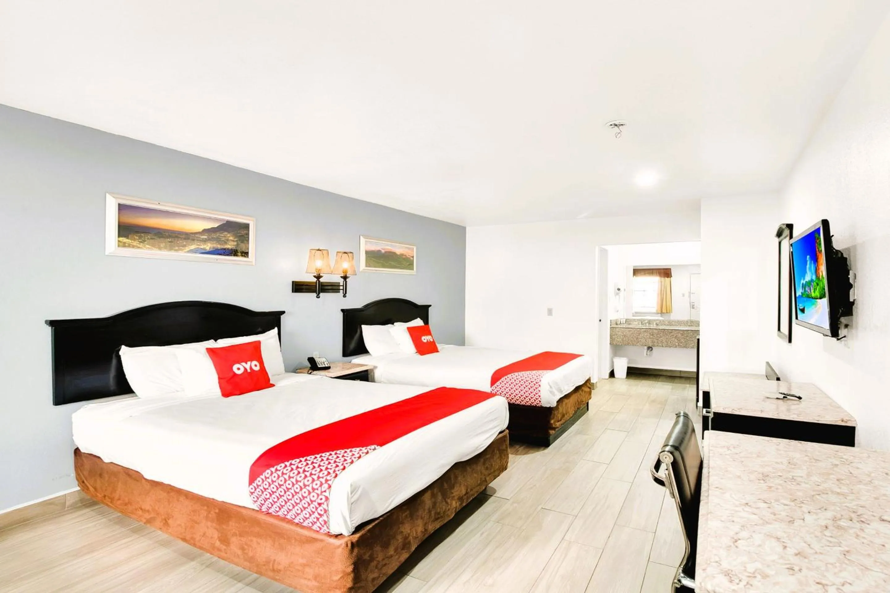 Bedroom, Bed in Three Rivers Executive Inn & Suites By OYO