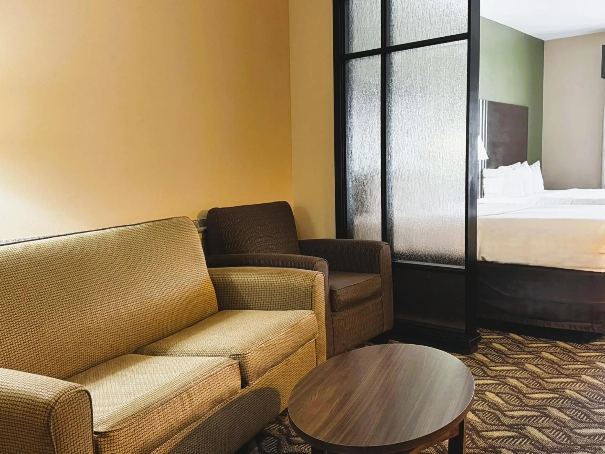 Seating area, Bed in Baymont by Wyndham Jewett