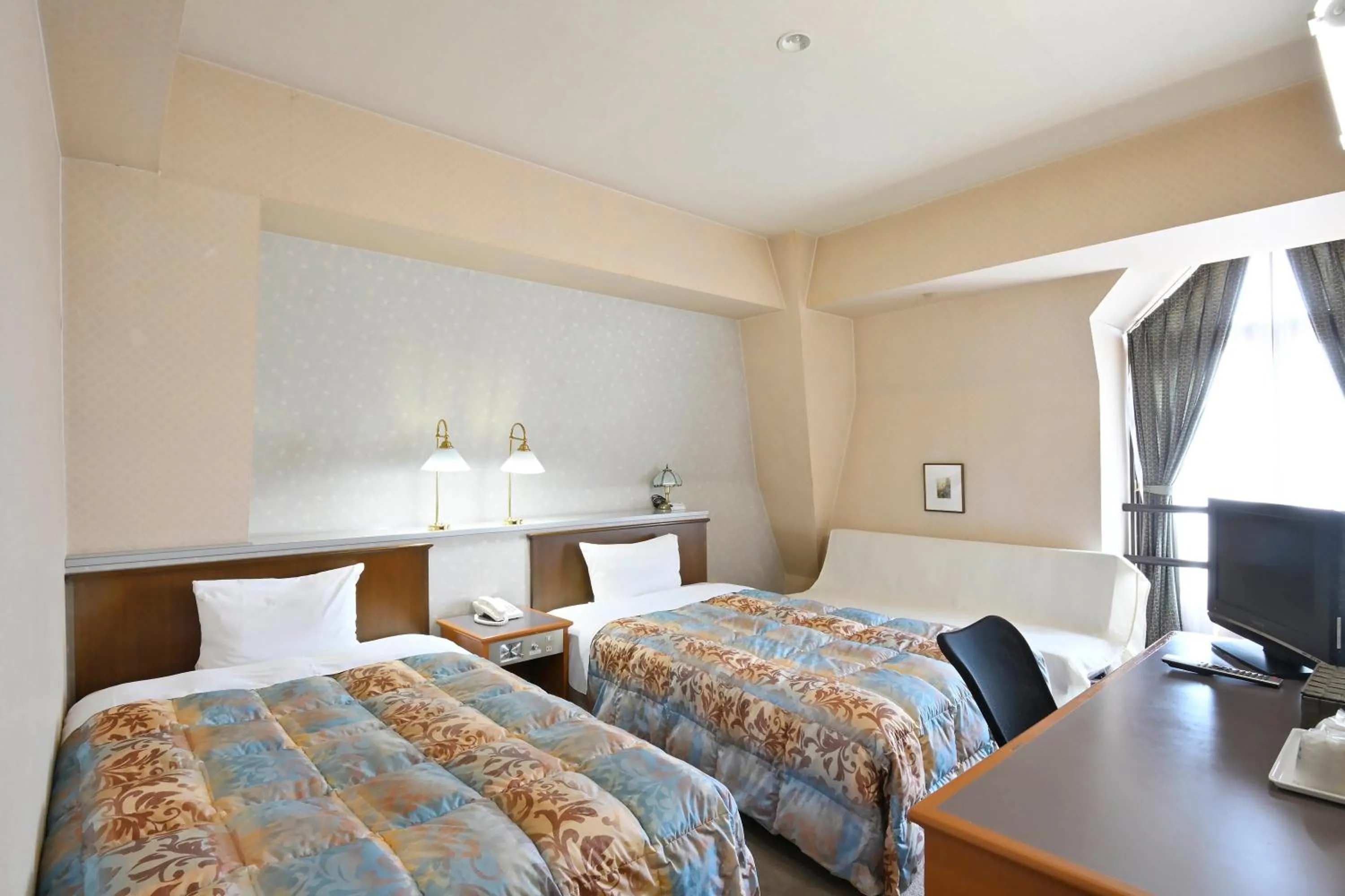 Bed in Hotel New Century Sakaide