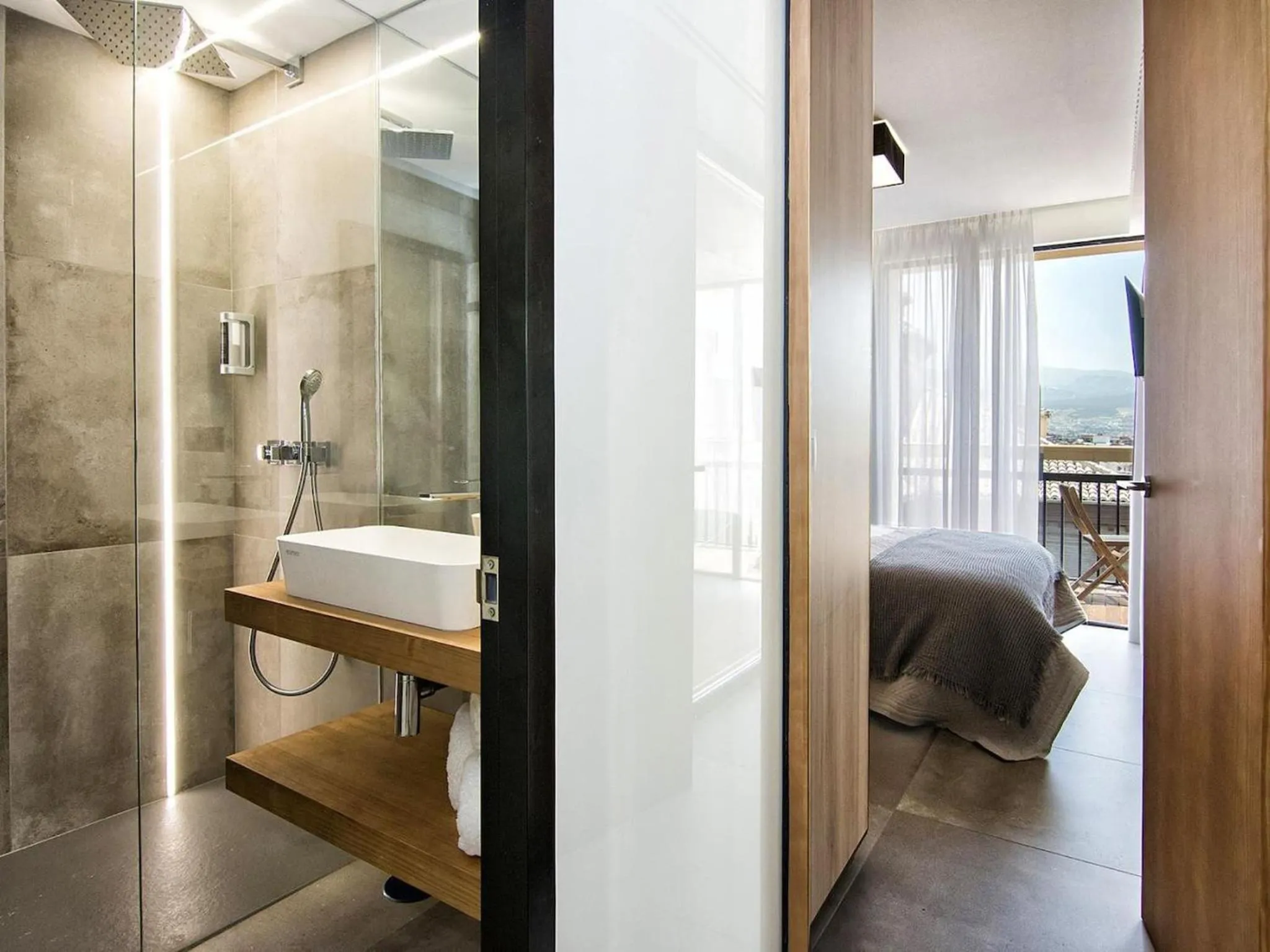 Shower, Bed in Luxury Alhambra Penthouse Collection