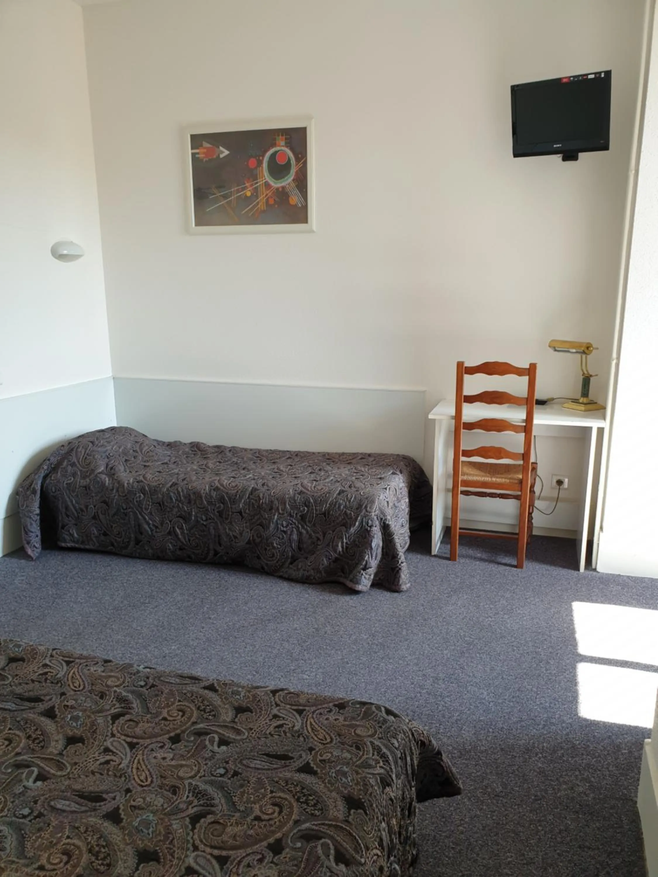 Photo of the whole room, Bed in Hôtel Malpel