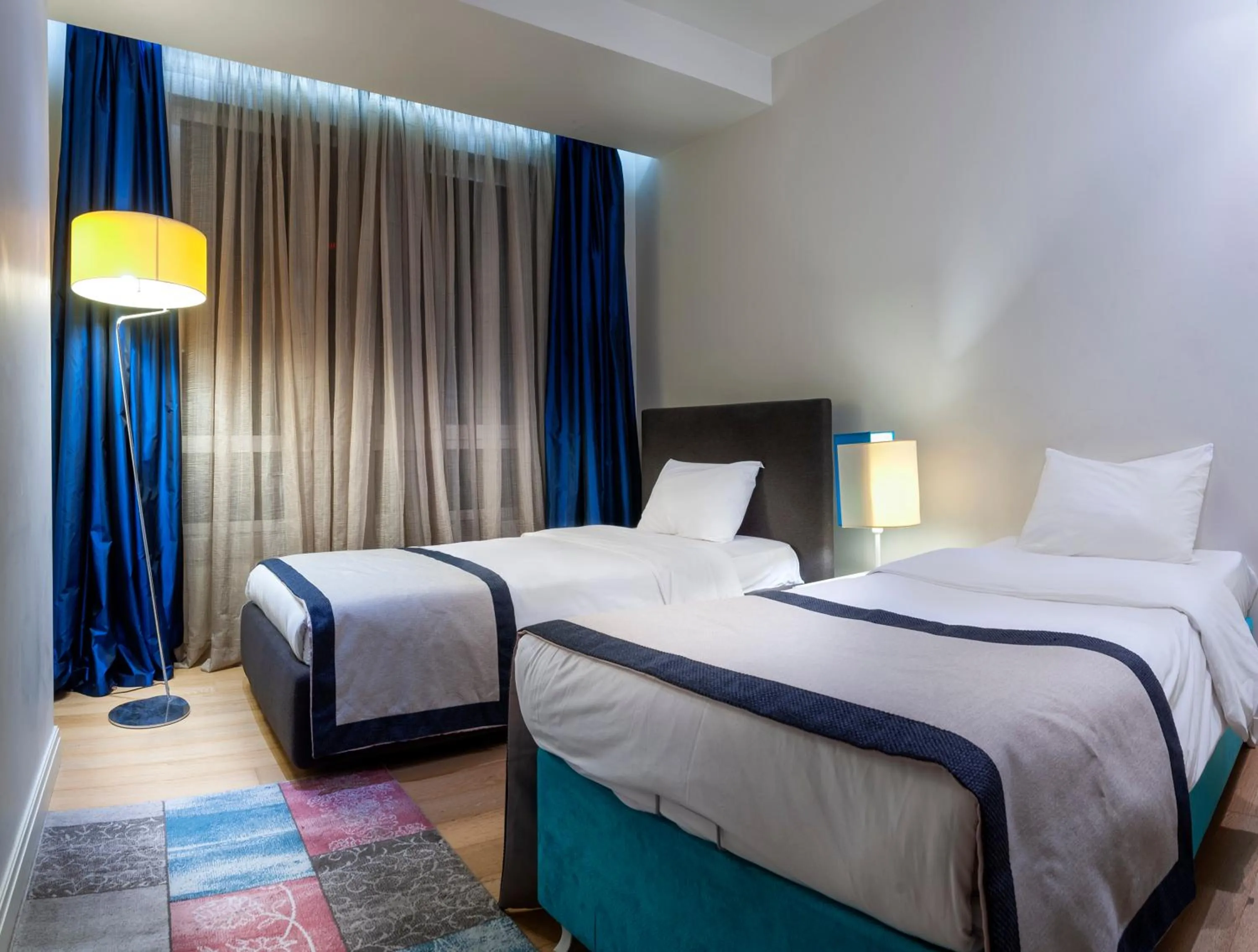 Bed in Armoni Residence & Hotel