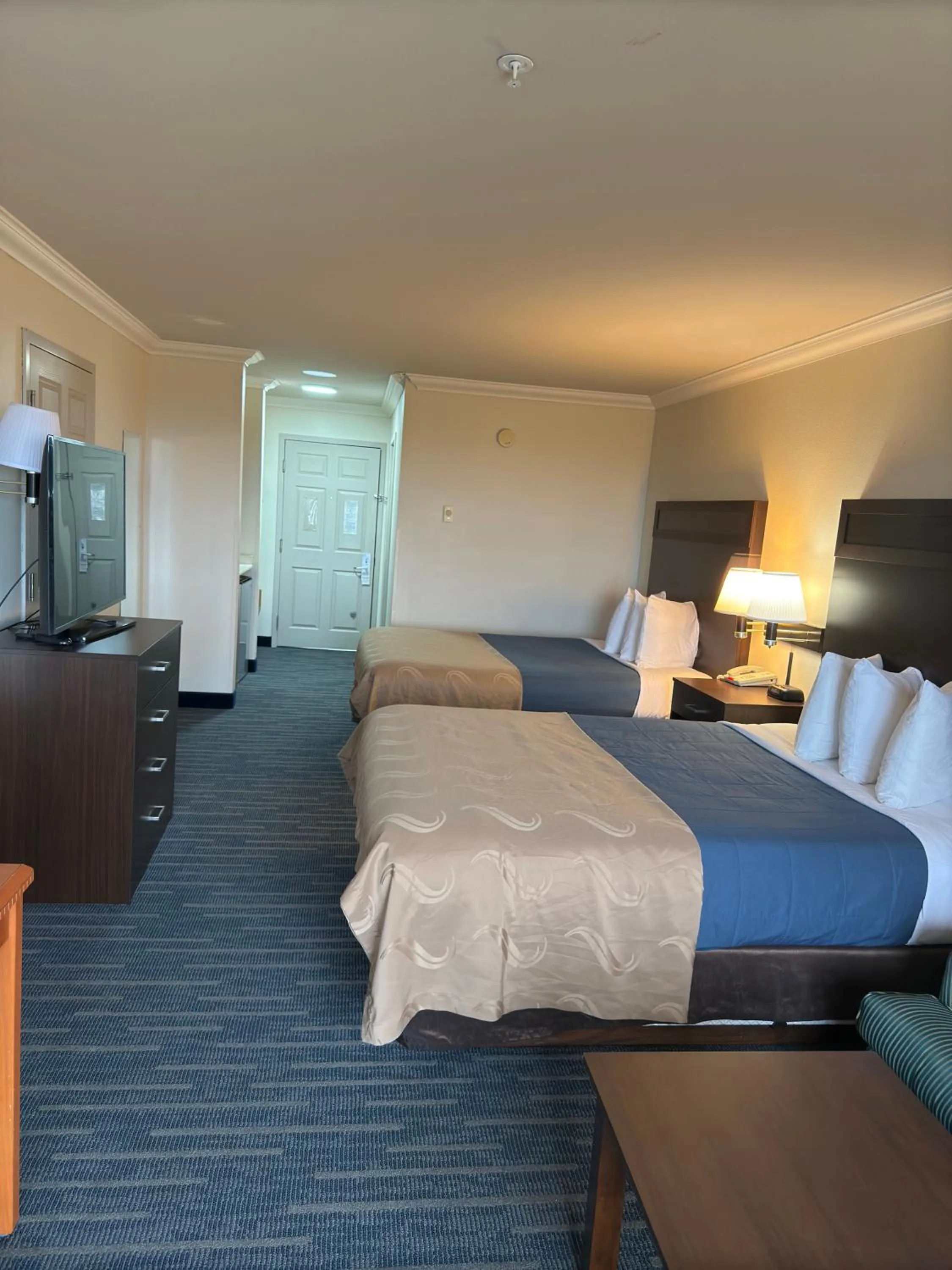 Bed in Coratel Inn and Suites By Jasper Ocean Shores