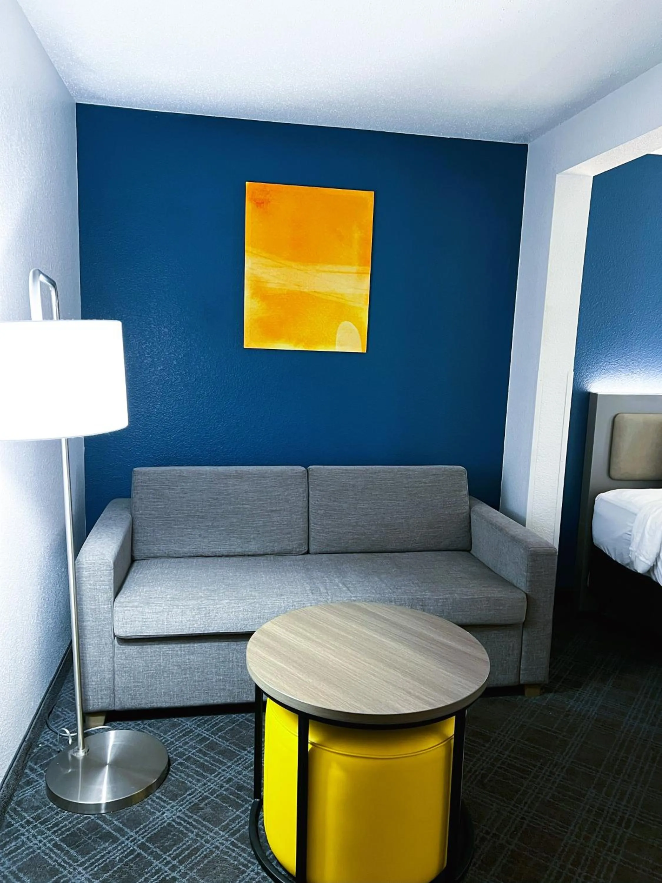 Seating area, Bed in Comfort Inn & Suites Sheboygan I-43