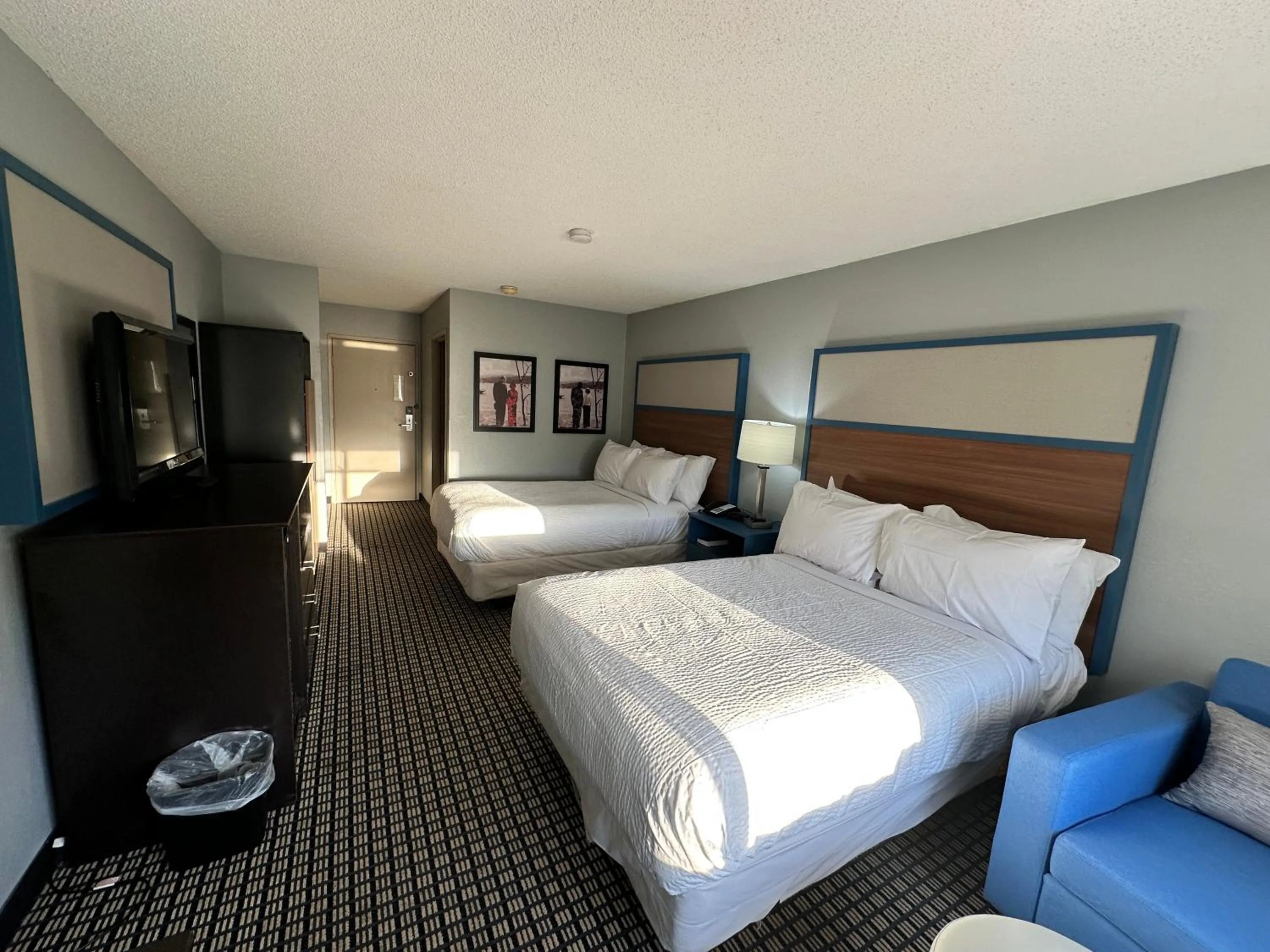 Bed in AmericInn by Wyndham Reedsburg