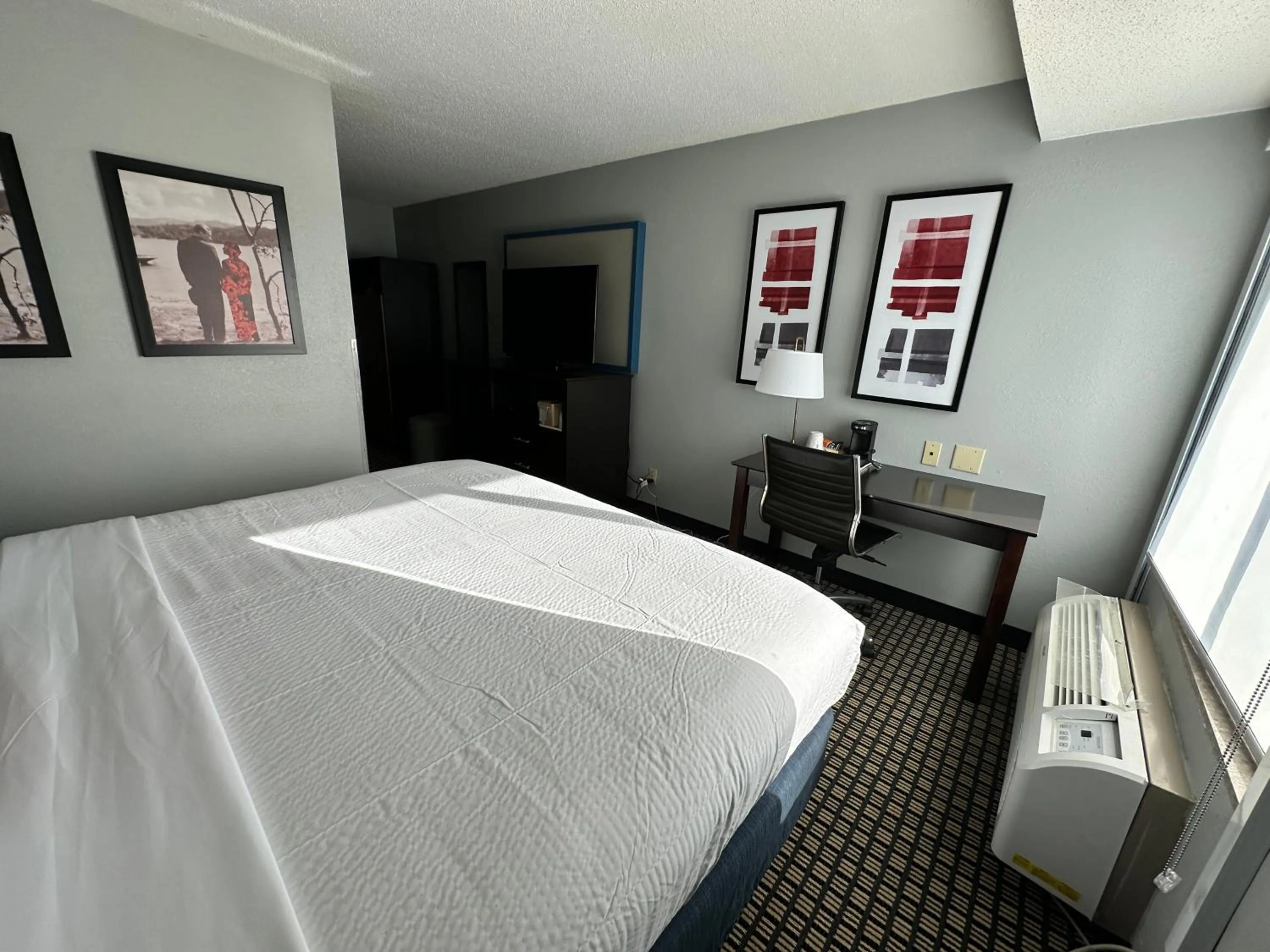 Bed in AmericInn by Wyndham Reedsburg