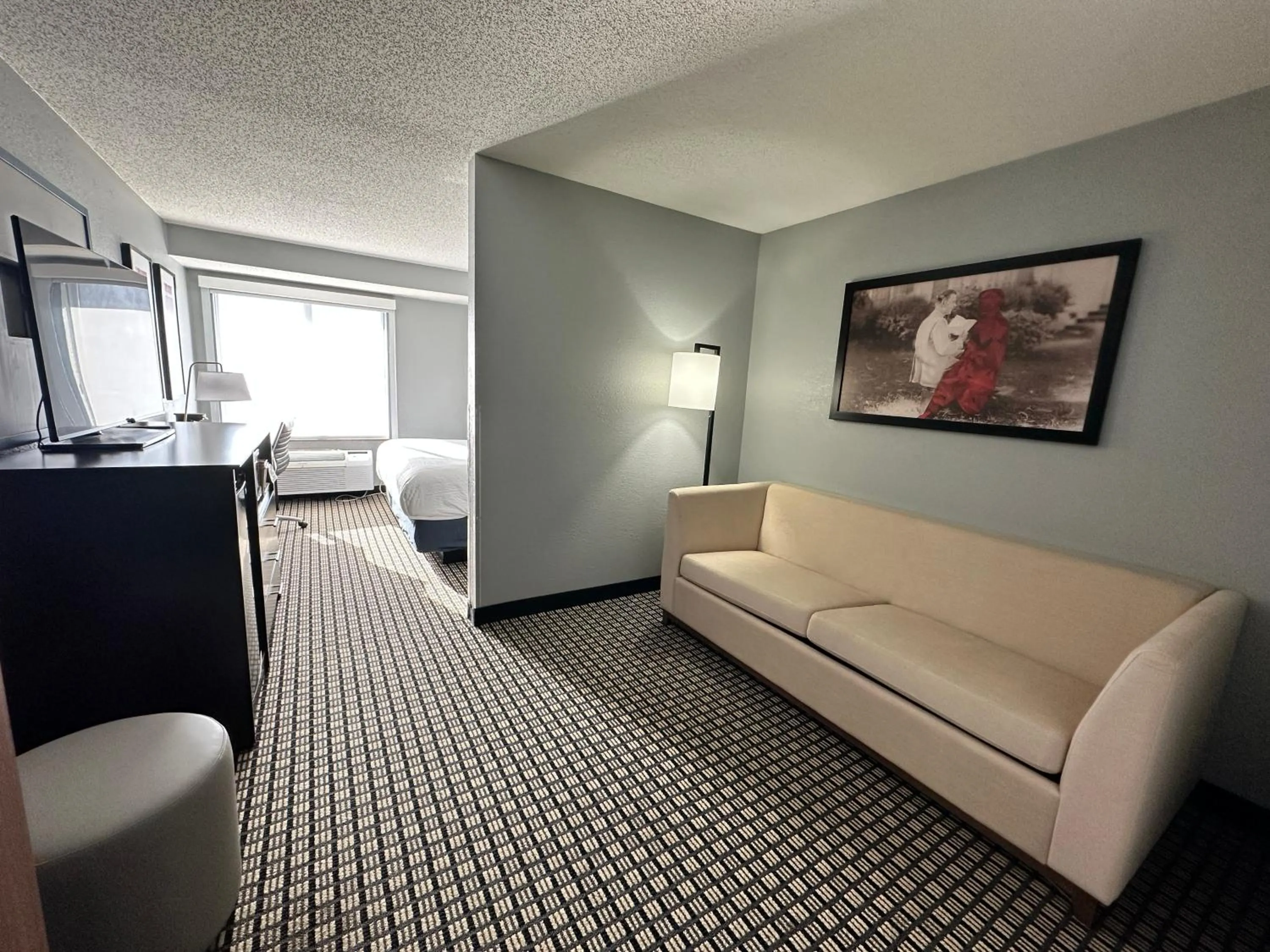 Bed in AmericInn by Wyndham Reedsburg