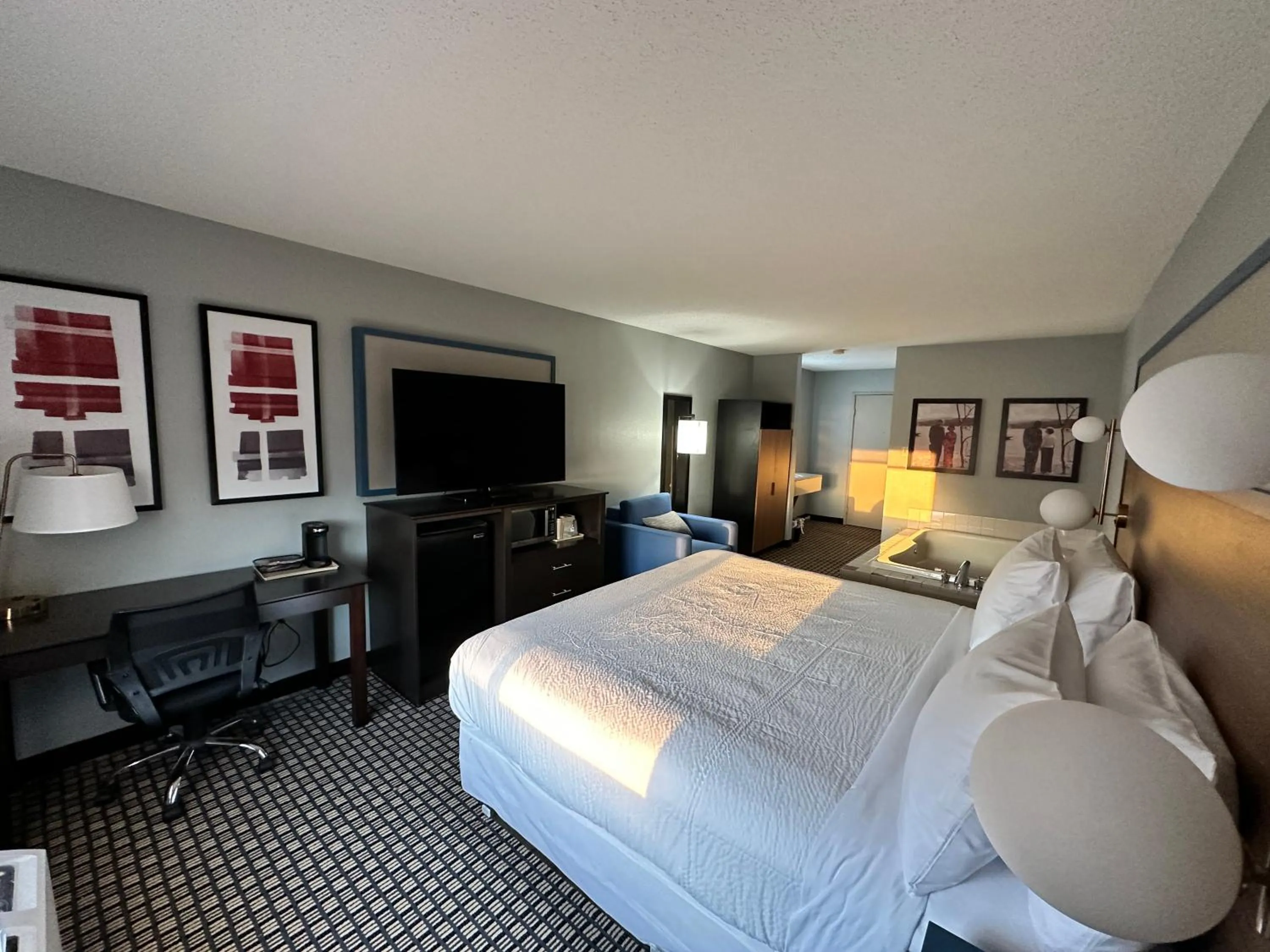 Bed in AmericInn by Wyndham Reedsburg