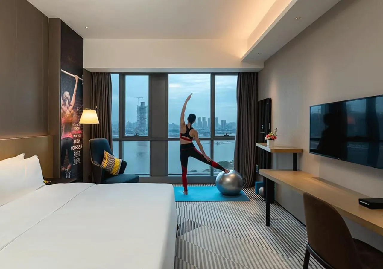 Communal lounge/ TV room, Bed in La Yarda Hotel Guangzhou