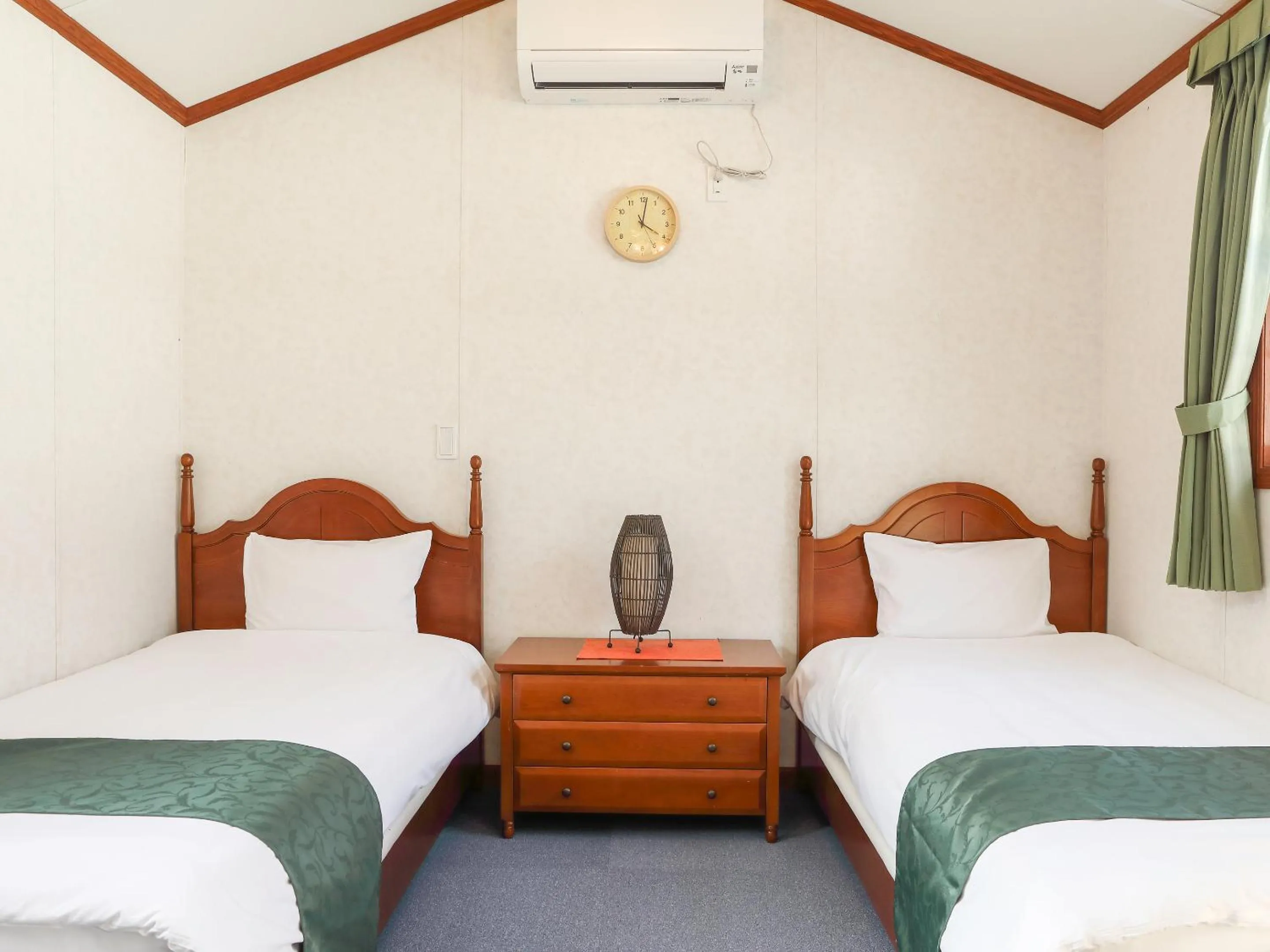 Bed in コテージスターハウス今帰仁