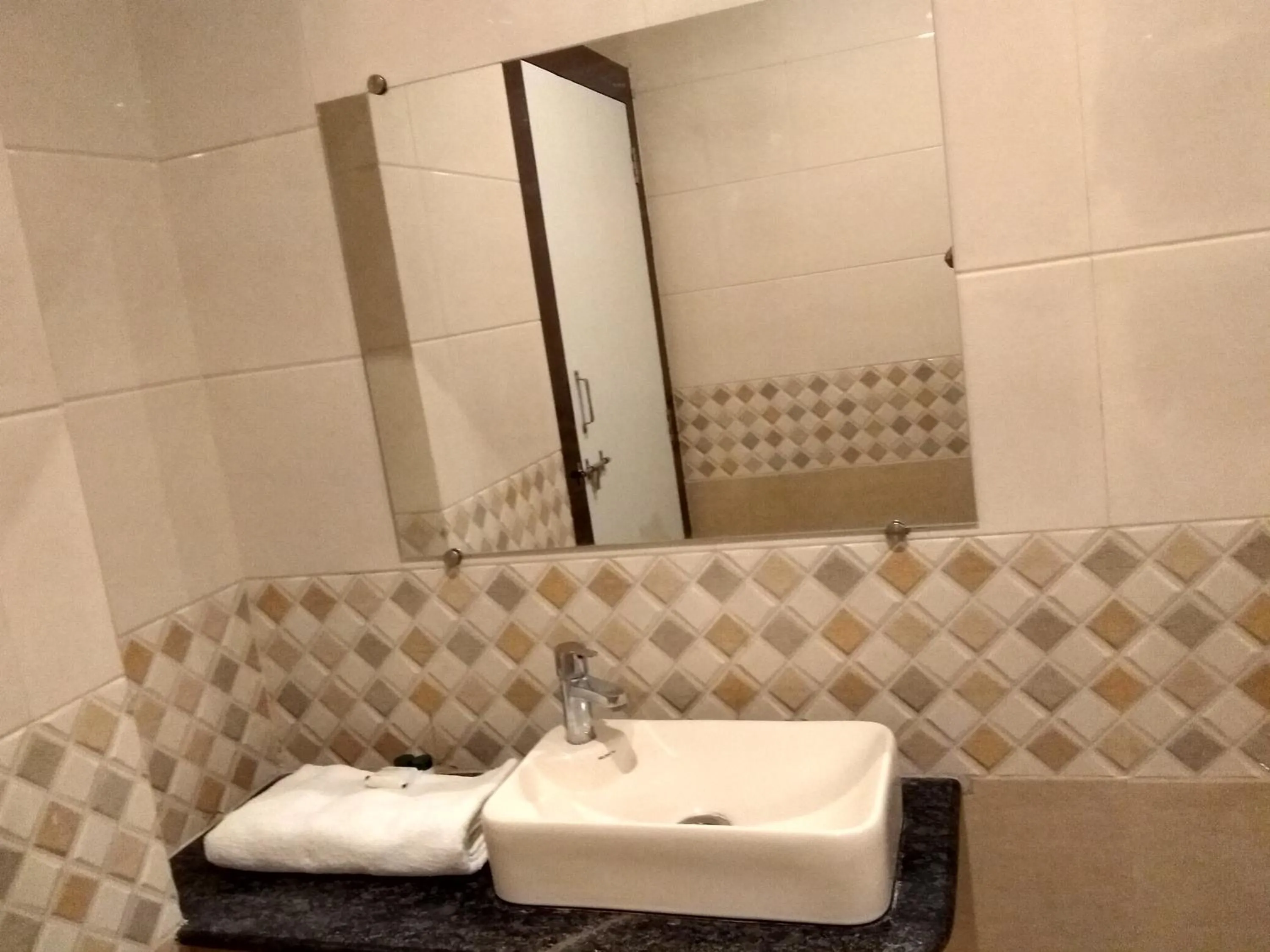 Bathroom in The JK Hotel Nr Railway Station