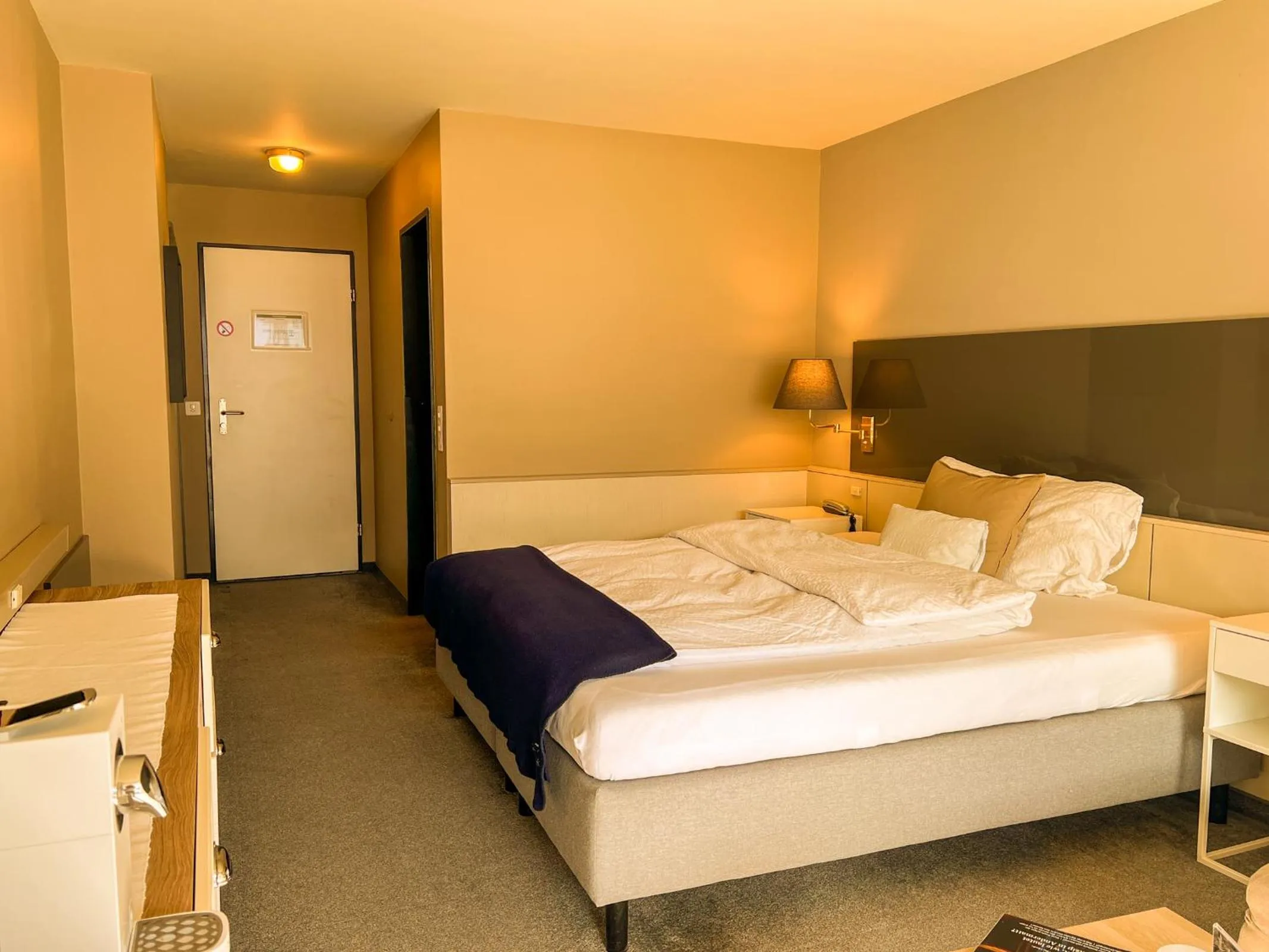 Living room, Bed in Seehotel Riviera at Lake Lucerne