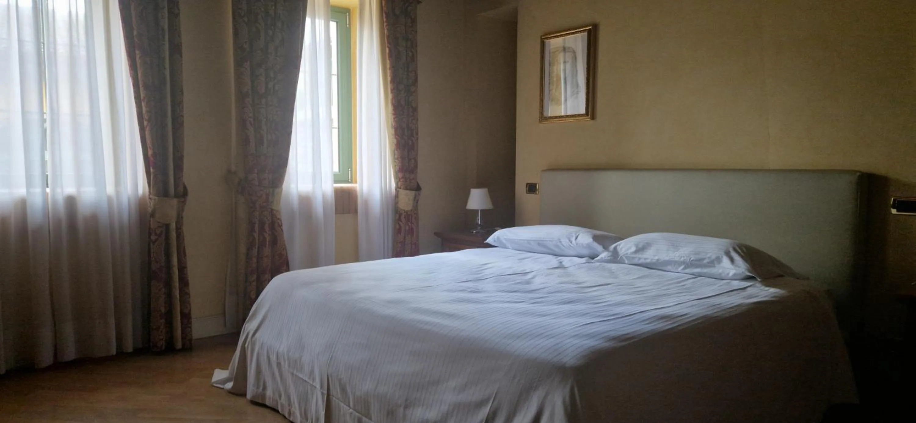 Bed in Relais La Colombara Spa & Wellness