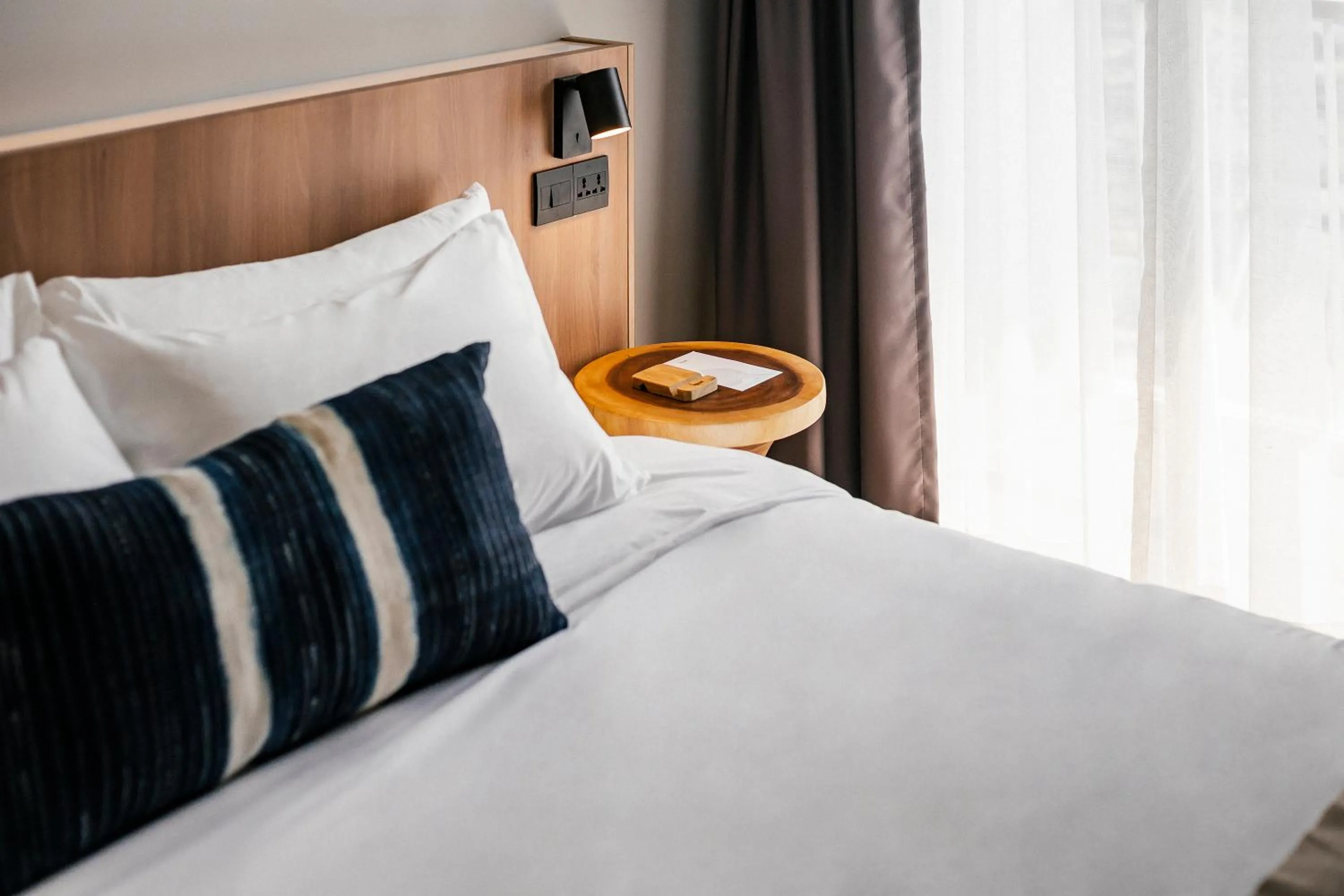 Bed in HOMM Boutique Hotel