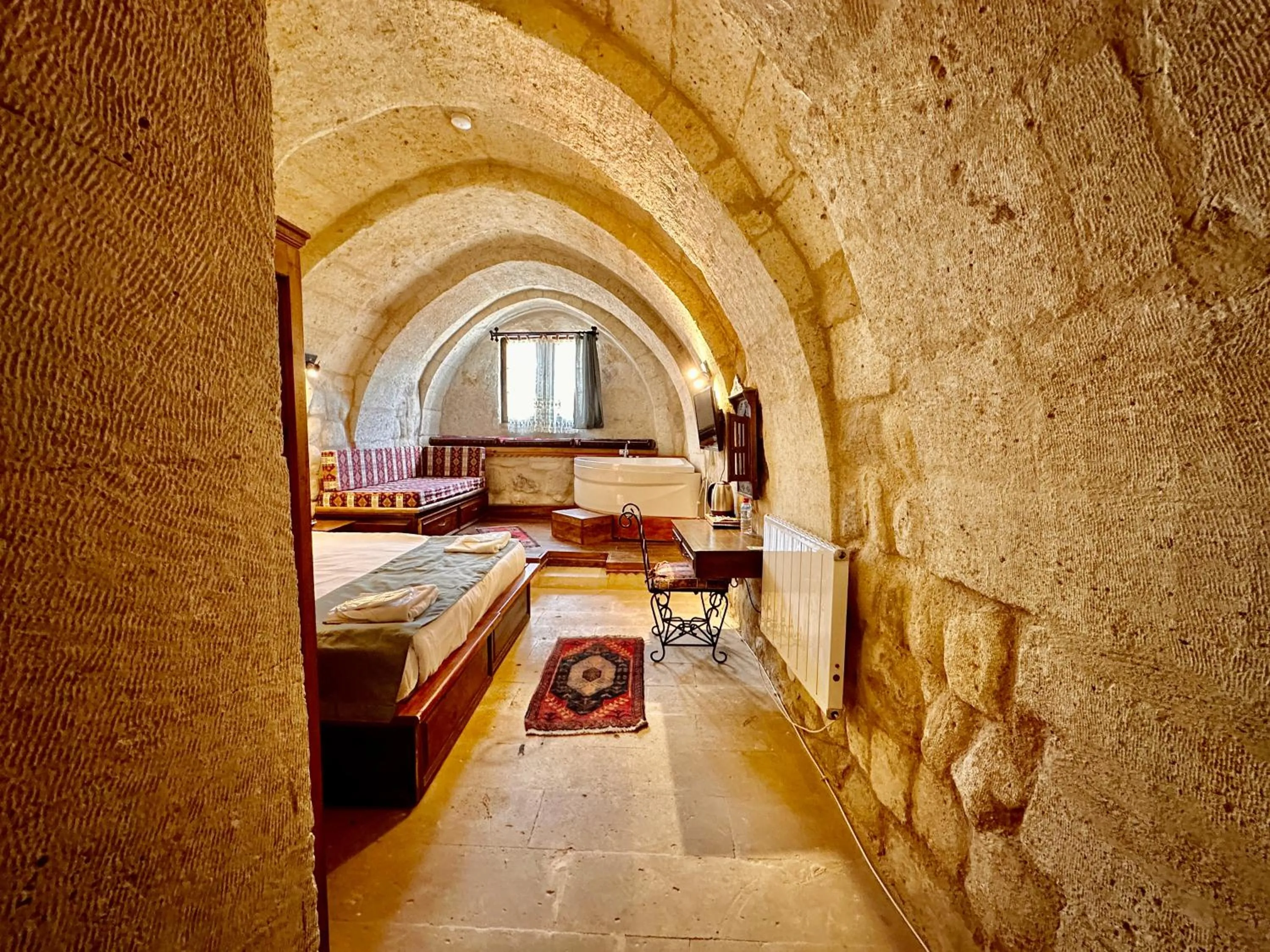 Bed in Harkasos Cave Hotel