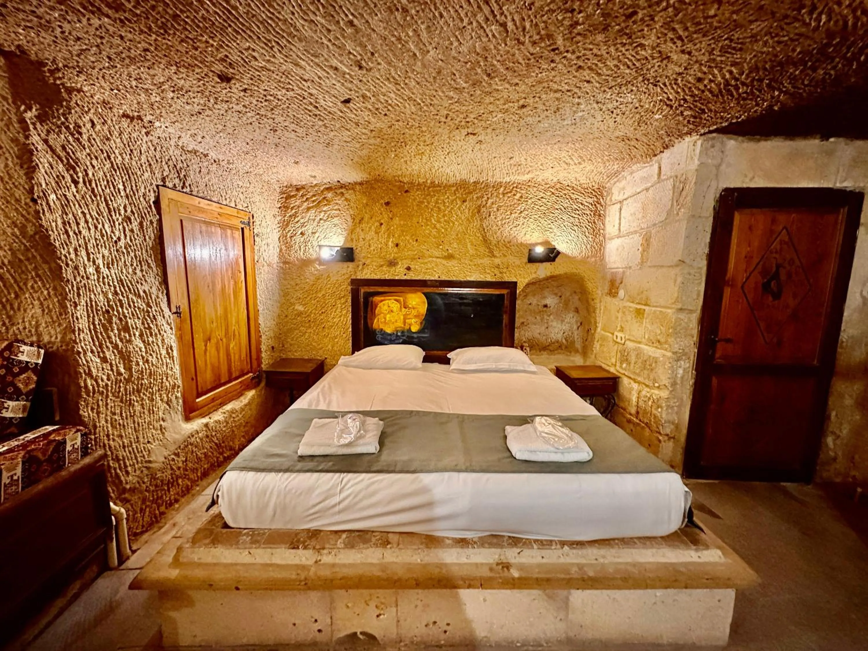 Bed in Harkasos Cave Hotel