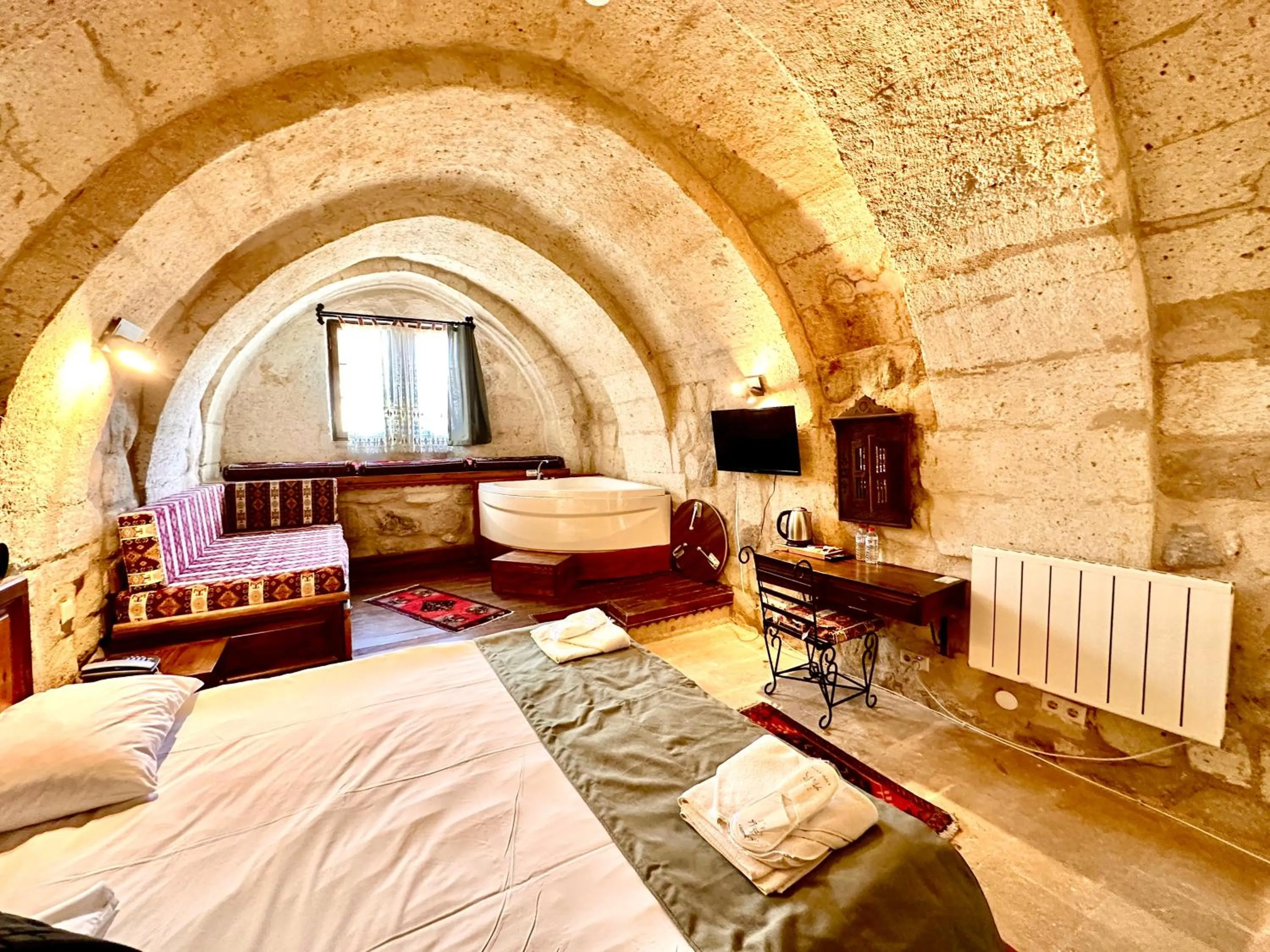 Bed in Harkasos Cave Hotel