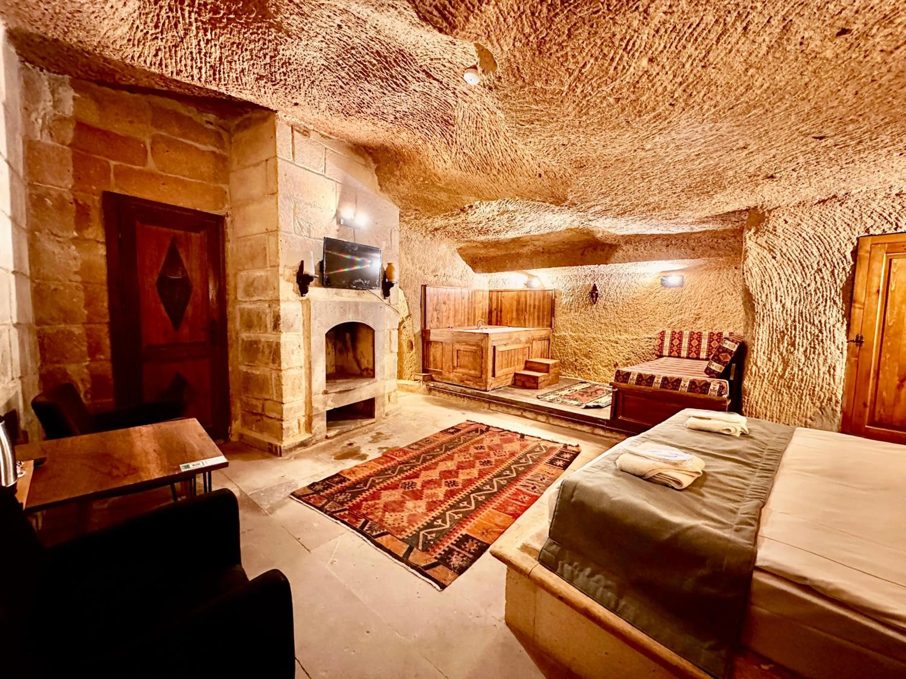 Bed in Harkasos Cave Hotel